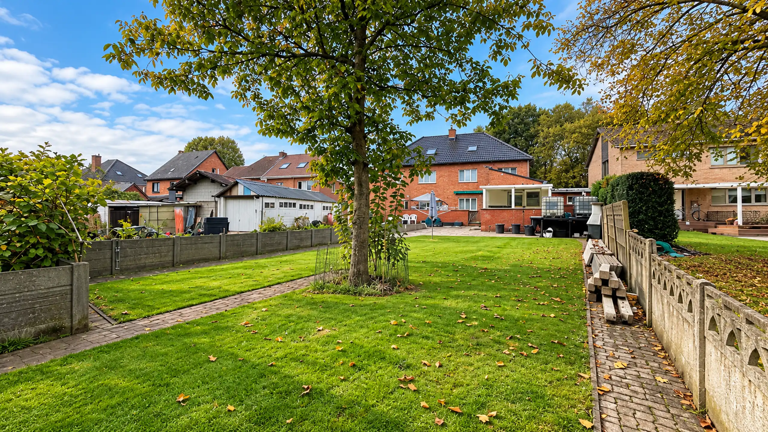 Instapklare halfopen bebouwing met zonnige tuin en garagebox foto 45