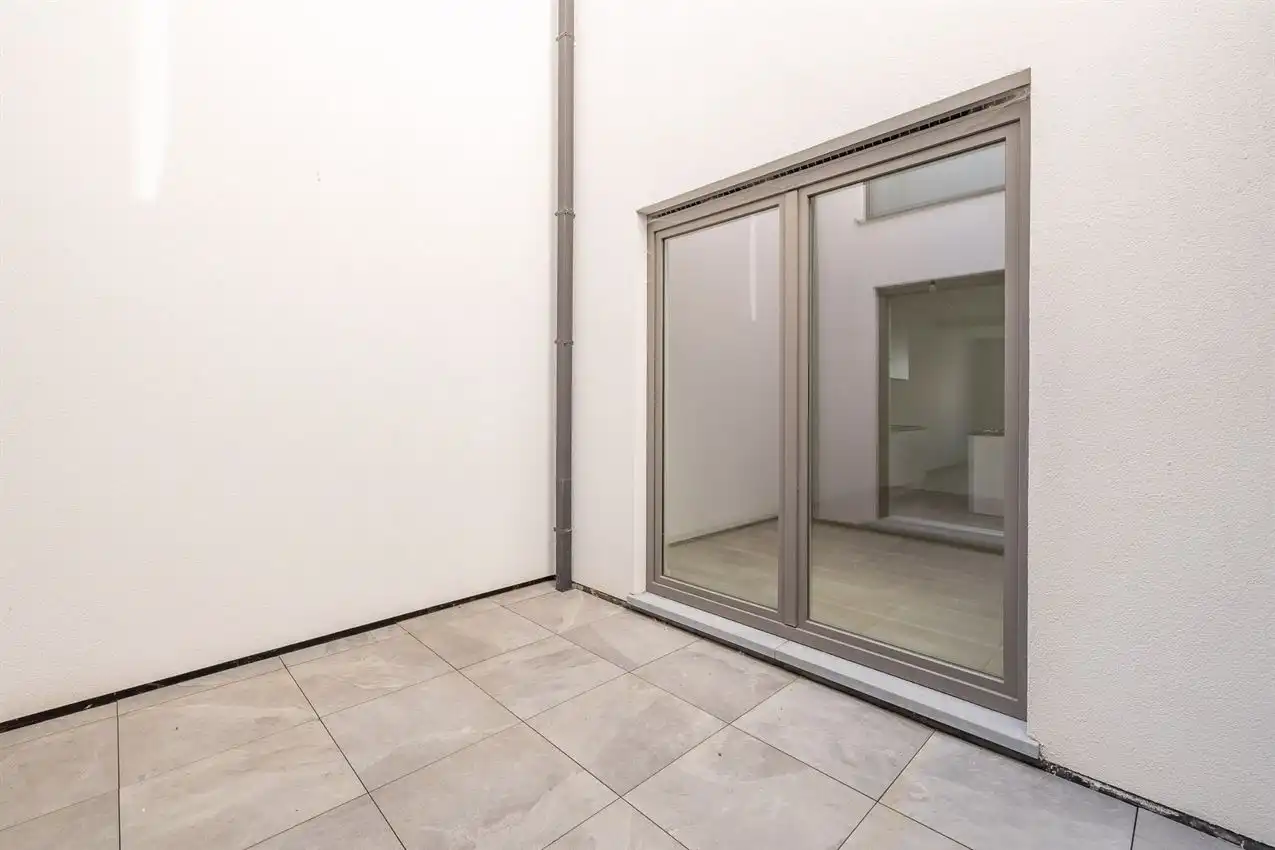 Nieuwbouwappartement met 1 slpk, autostaanplaats en terras foto 16