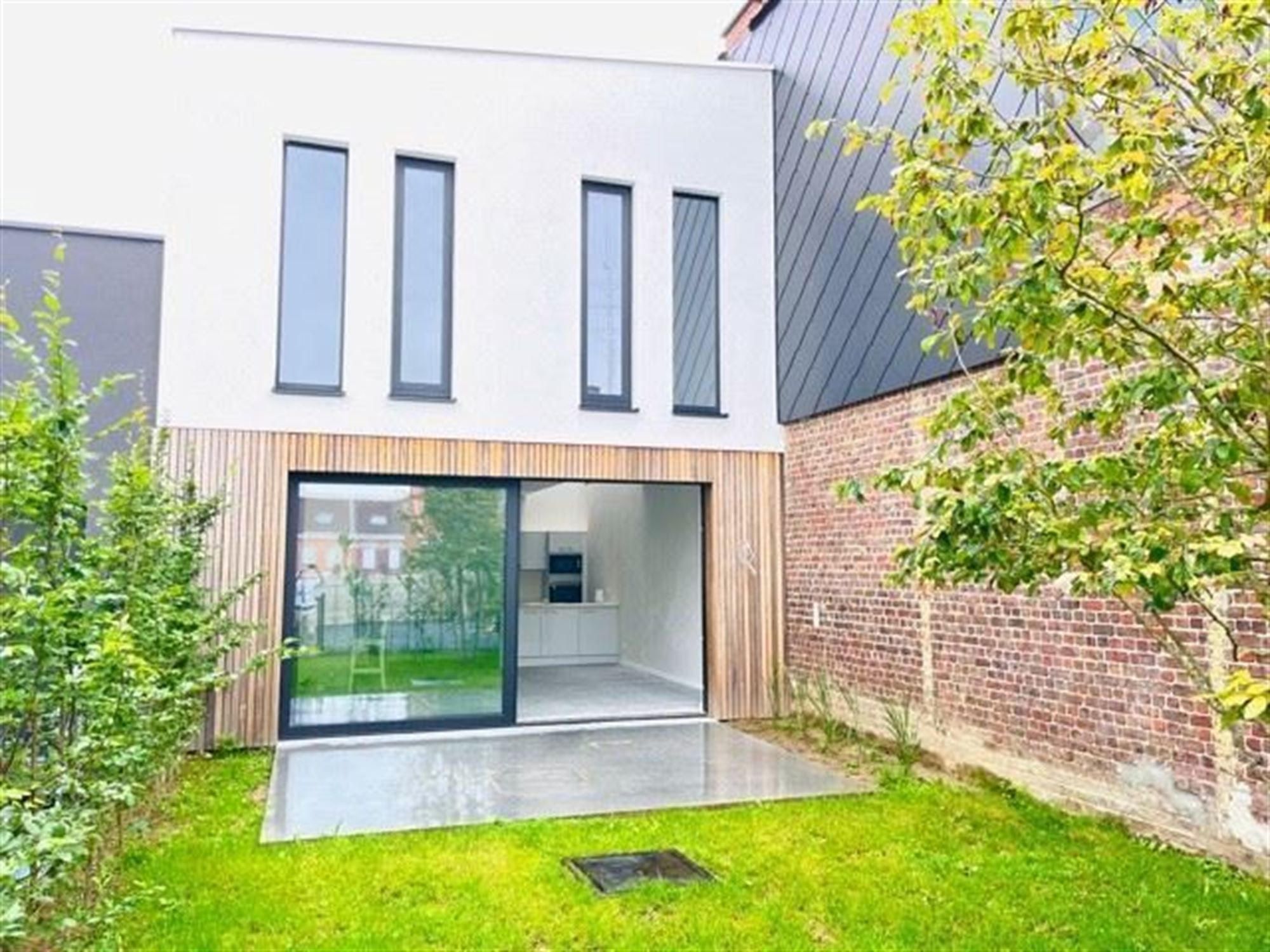 Rijwoning met 3 slaapkamers, terras en tuin foto 2