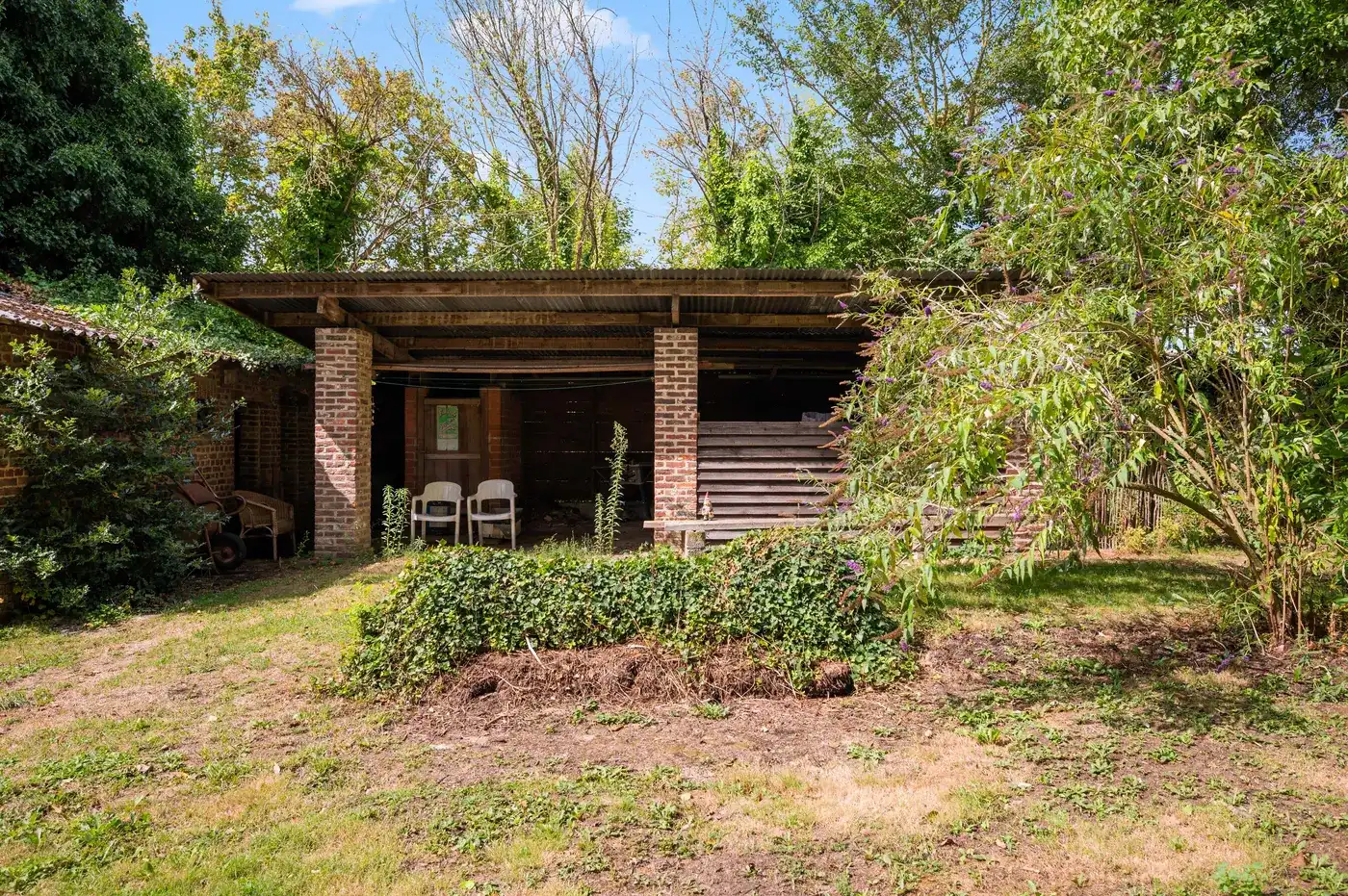 Open bebouwing in Linter met groot perceel en tuin foto 25
