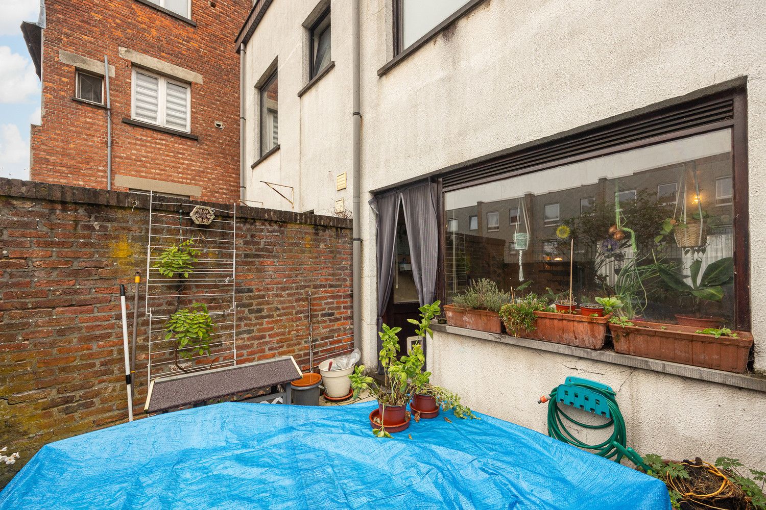 Te renoveren 4-slk woning met garage nabij Berchem-station foto 8