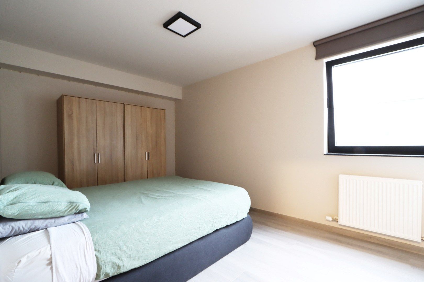 Gelijkvloers appartement met tuintje, terras, autostandplaats en kelderberging in hartje Maaseik  foto 10