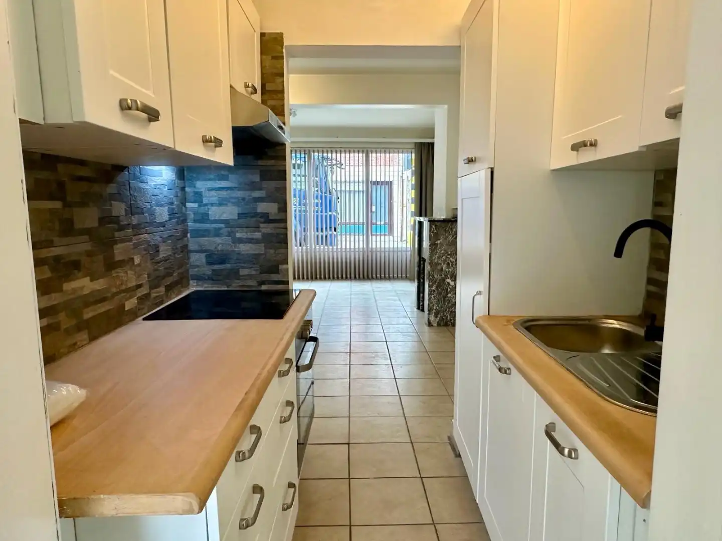 Te huur in Merchtem: compact 1-slpk-appartement met terras foto 3