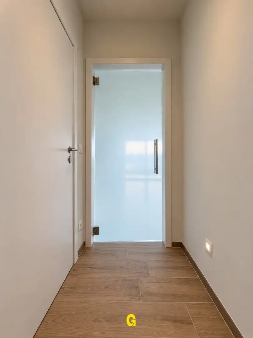Nieuwbouwappartement met 2 slaapkamers, ruim terras, standplaats en berging te Munsterbilzen - Label A foto 9
