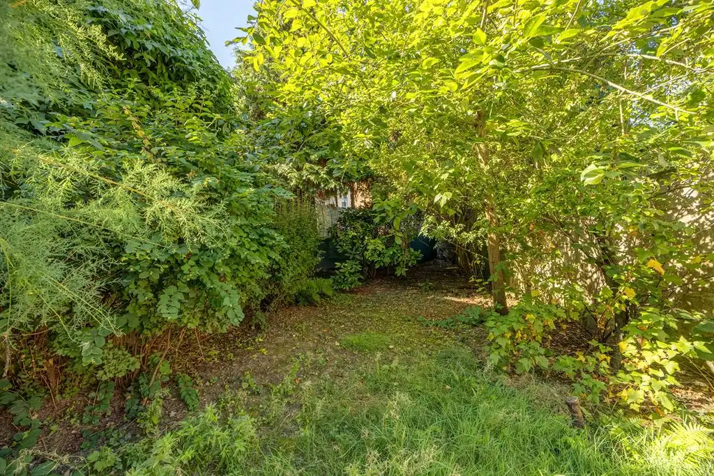 Op te frissen gezinswoning met tuin in Groenenhoek foto 8