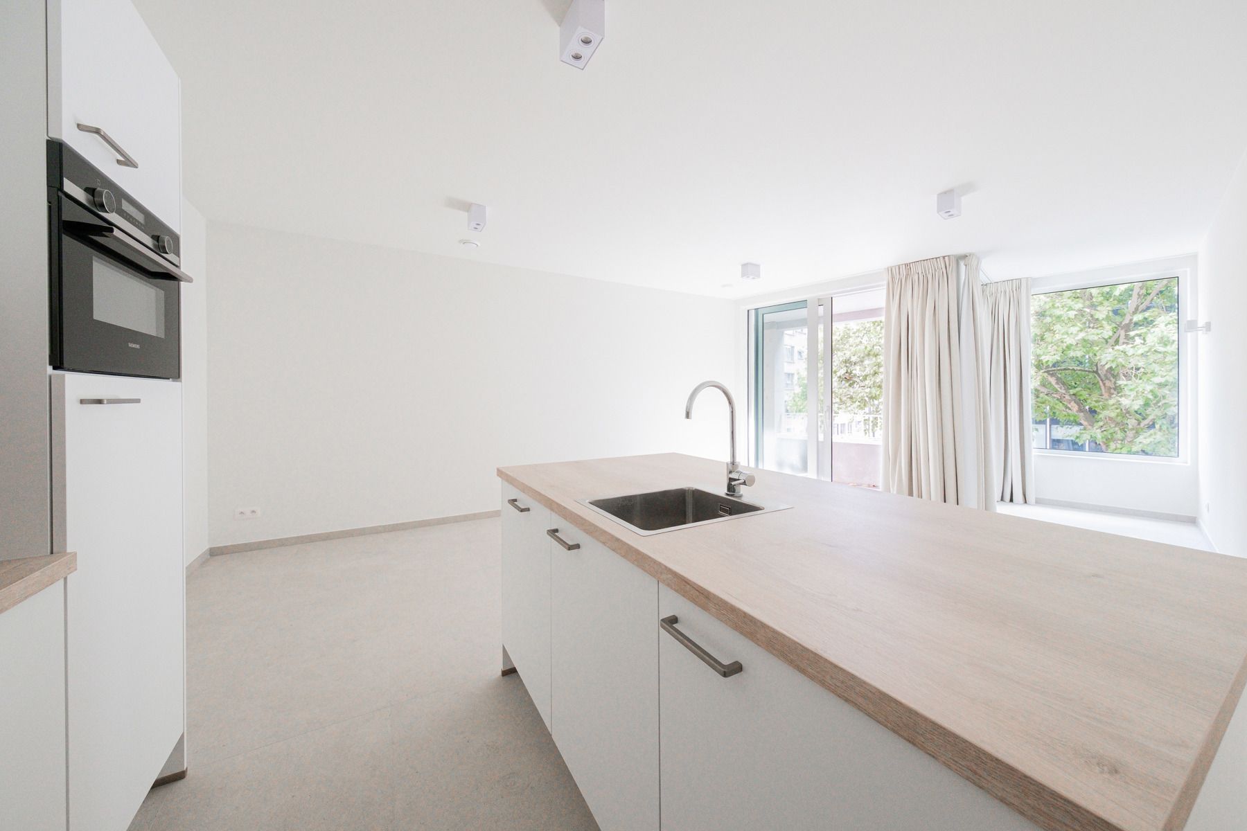 Nieuwbouwappartement op toplocatie met terras! foto 2