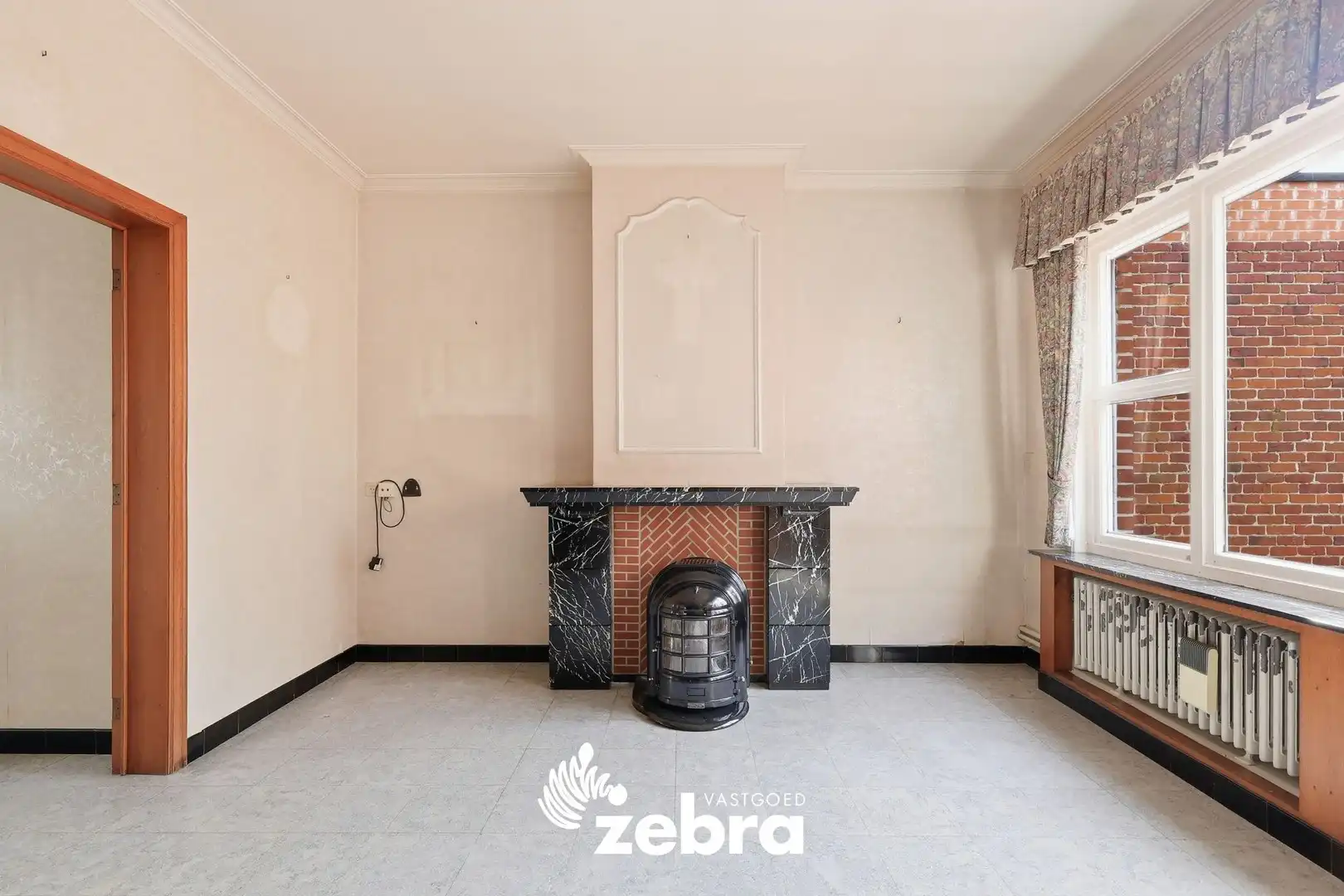 Woning met veel potentieel, 3 slaapkamers en ruime zolder in hartje Tielt! foto 4