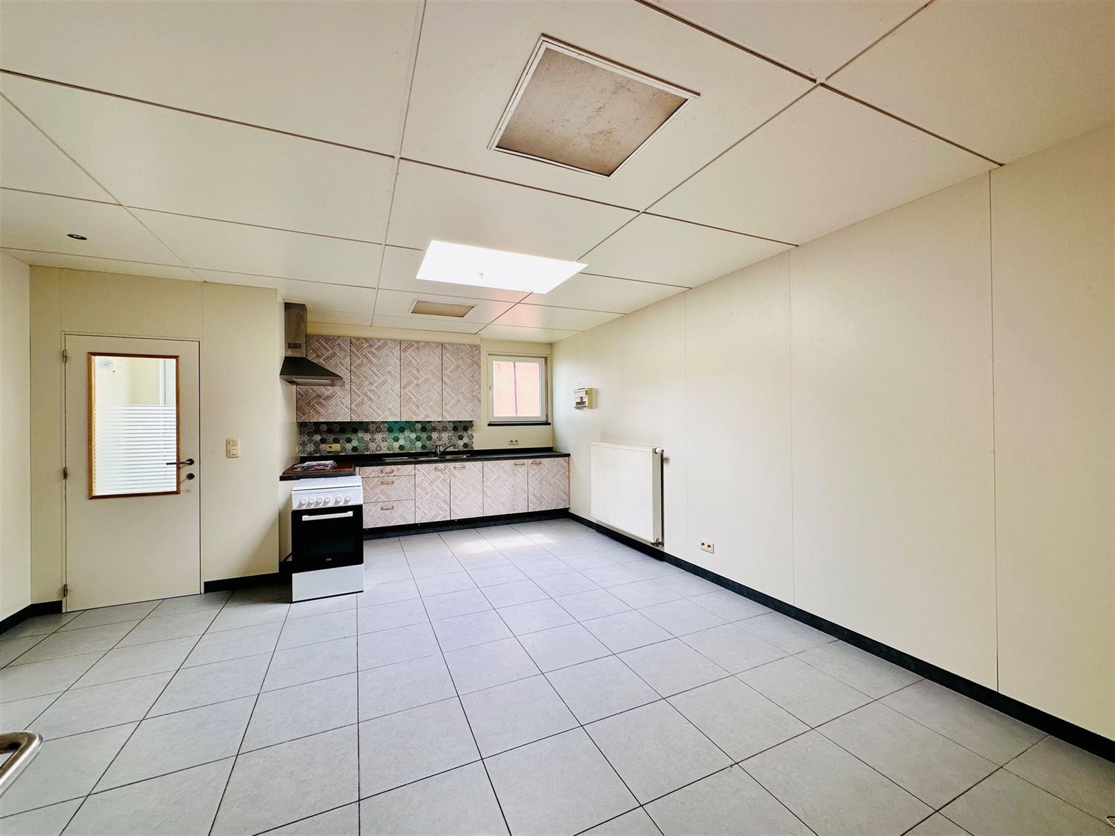 Ruime woning met diepe tuin in Grembergen met mogelijkheid tot handel of zelfstandige activiteit foto 7