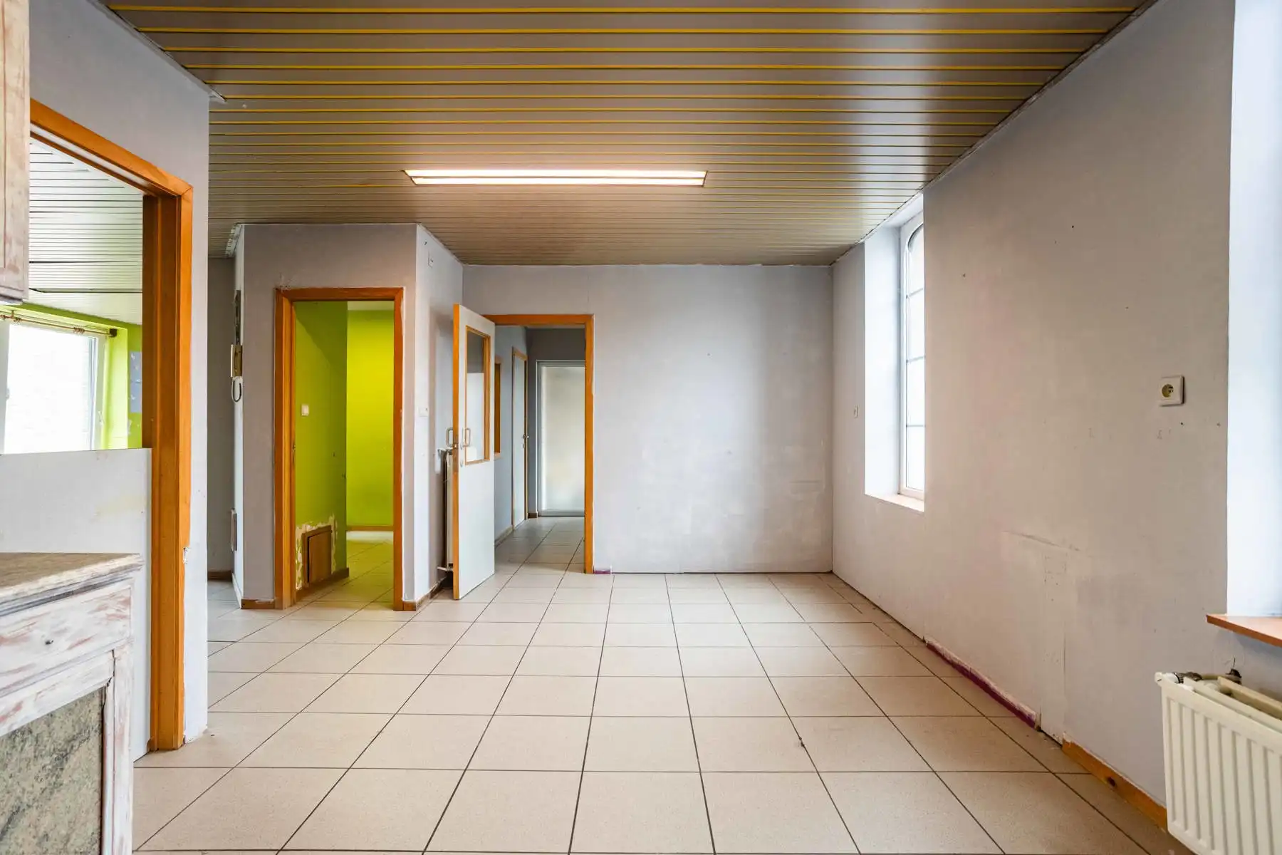 Polyvalente woning met tuin:  momenteel 2 appartementen garage en groot magazijn! foto 5