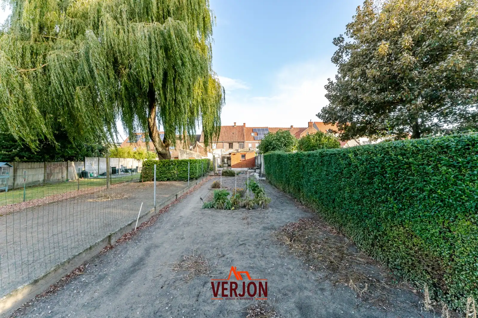 Charmante woning met ruime tuin te koop op het dorpsplein in Kachtem! foto 17