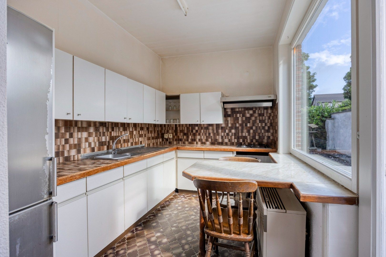 Charmante rijwoning met terras en diepe tuin aan centrum Tongeren foto 10