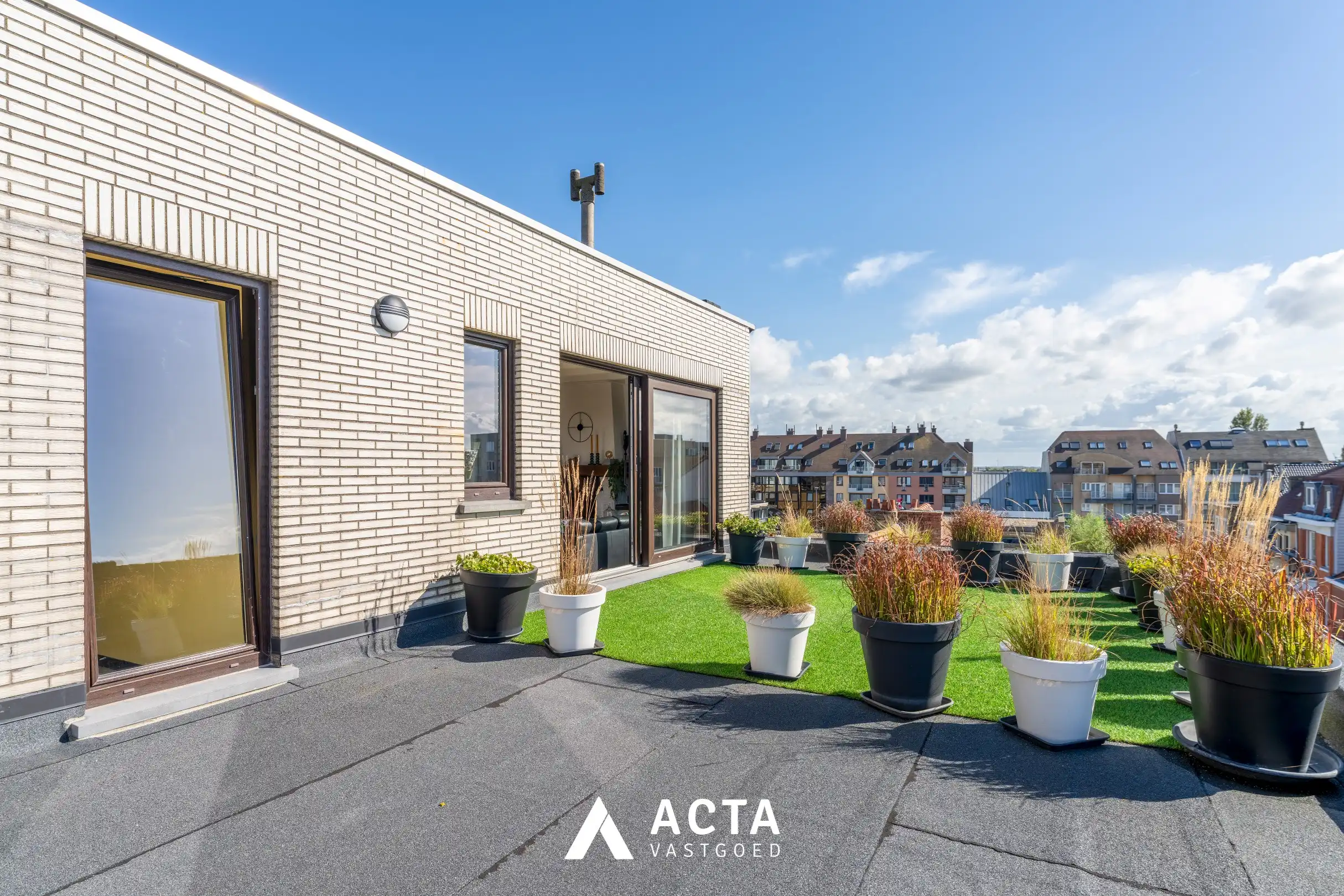 Dakappartement met zonnige terrassen in Mariakerke foto 13
