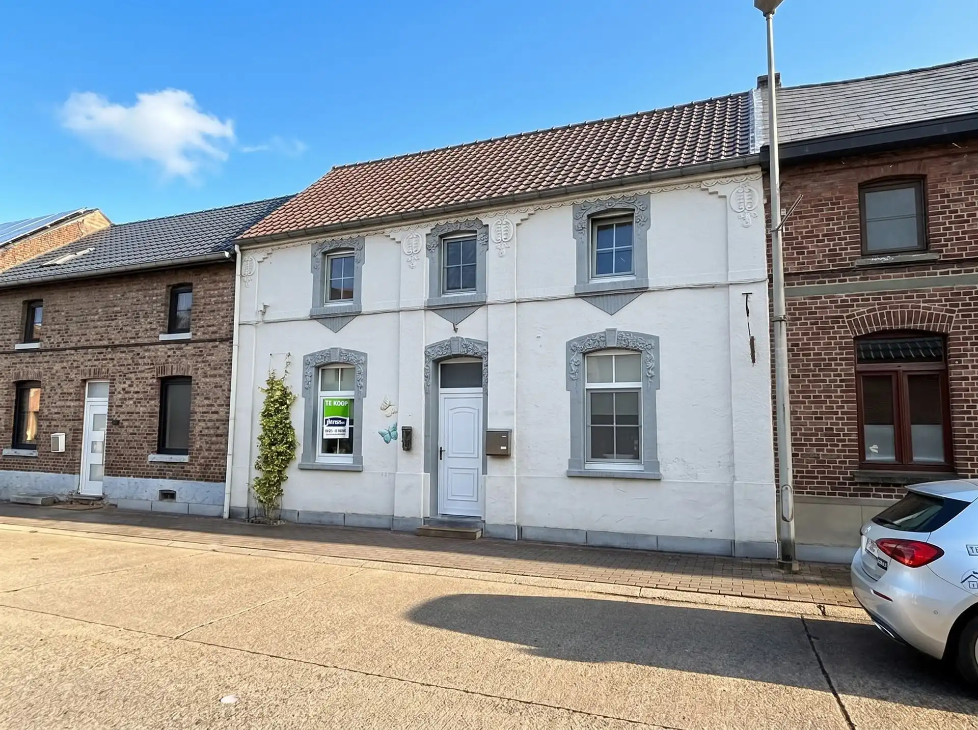 Hoofdfoto van de publicatie: Charmante gezinswoning met 3 slaapkamers, afgewerkte zolder, garage en een unieke ligging.