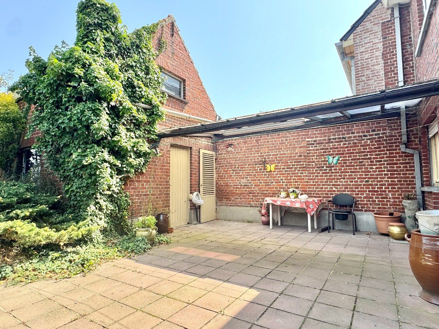 Halfopen woning te koop in Hulste met tuin, mogelijkheid tot 6 slaapkamers en garage. foto 8