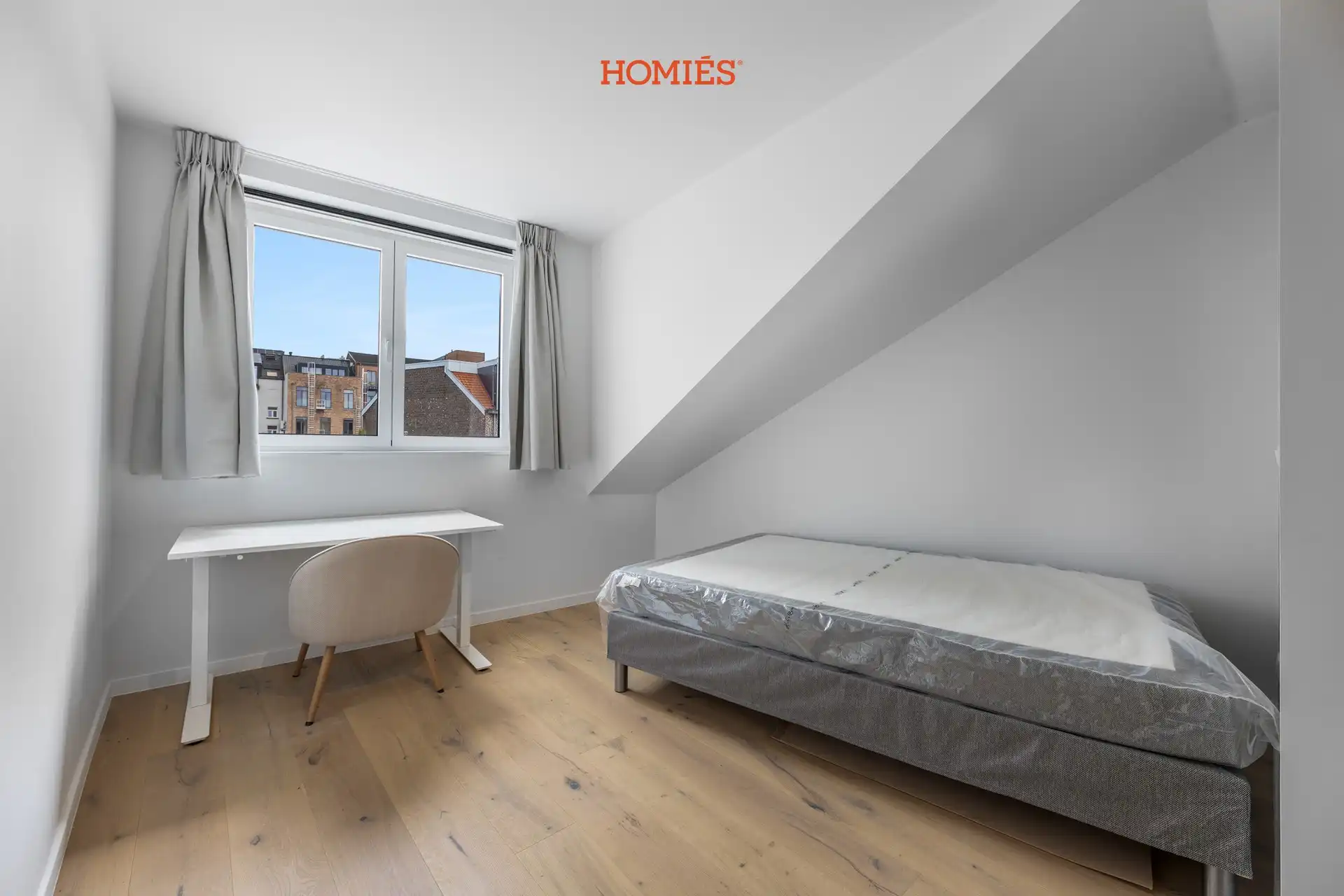 Karaktervolle dakkamer met eigen sanitair foto {{pictureIndex}}
