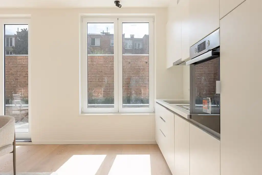 Luxueus gelijkvloers app met ruime tuin foto 4