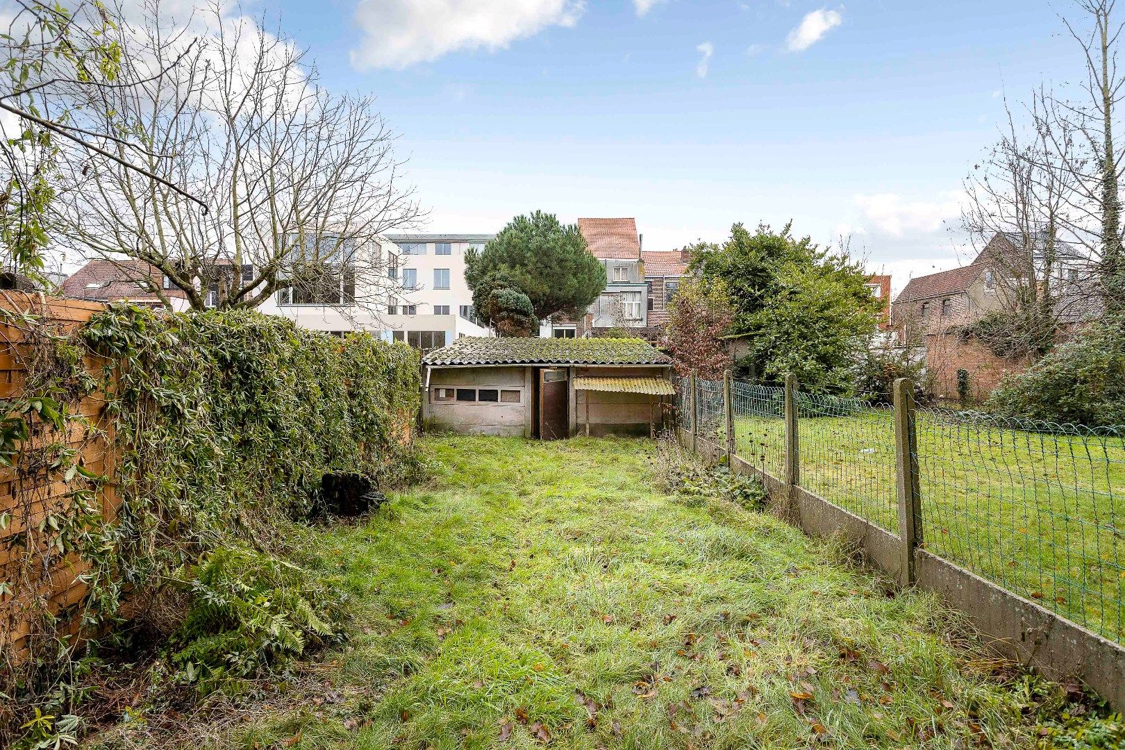 Te renoveren opbrengsteigendom met twee appartementen, parkings en tuin foto 23