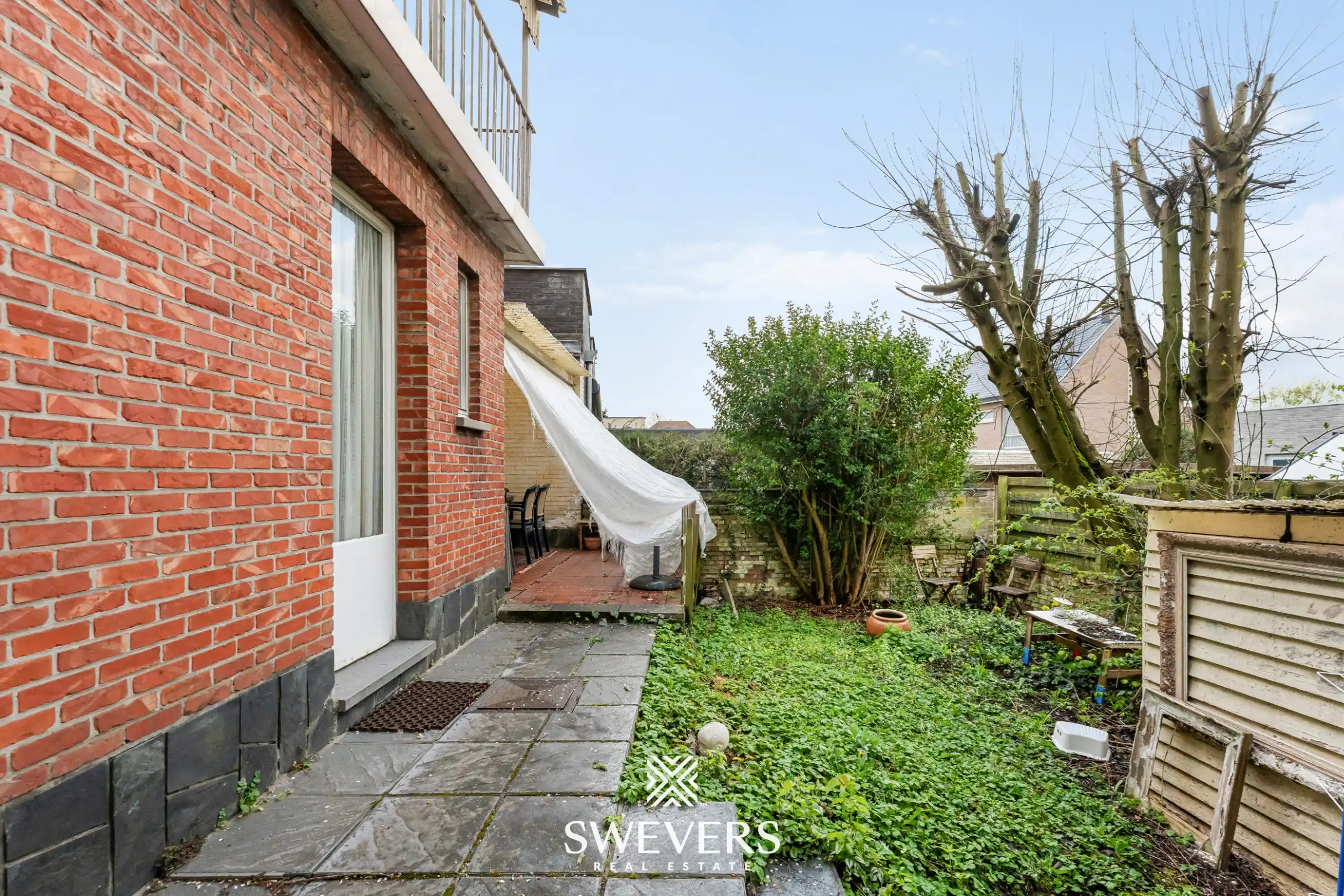 Ruime halfopen bebouwing met 4 slaapkamers en veel renovatiepotentieel op topligging in Hasselt foto 24