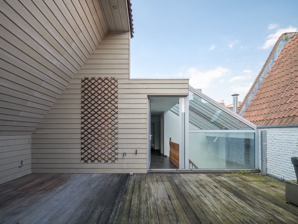 Unieke triplex woning met lift en terras en zicht op de Vrijdagmarkt foto 6