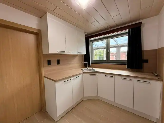 Halfopen woning met 3 slaapkamers, inpandige garage en mooie tuin in Kleine Brogel. foto 11