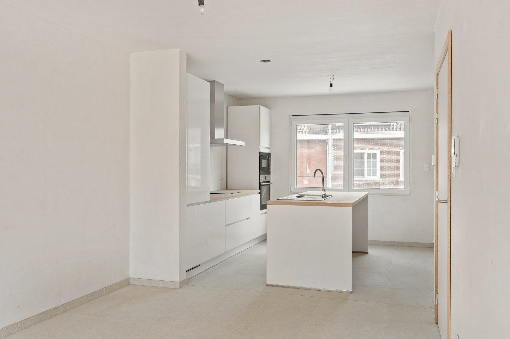 DUPLEX NIEUWBOUWAPPARTEMENT MET 2 SLPKS EN RUIM TERRAS TE GELUWE foto 6