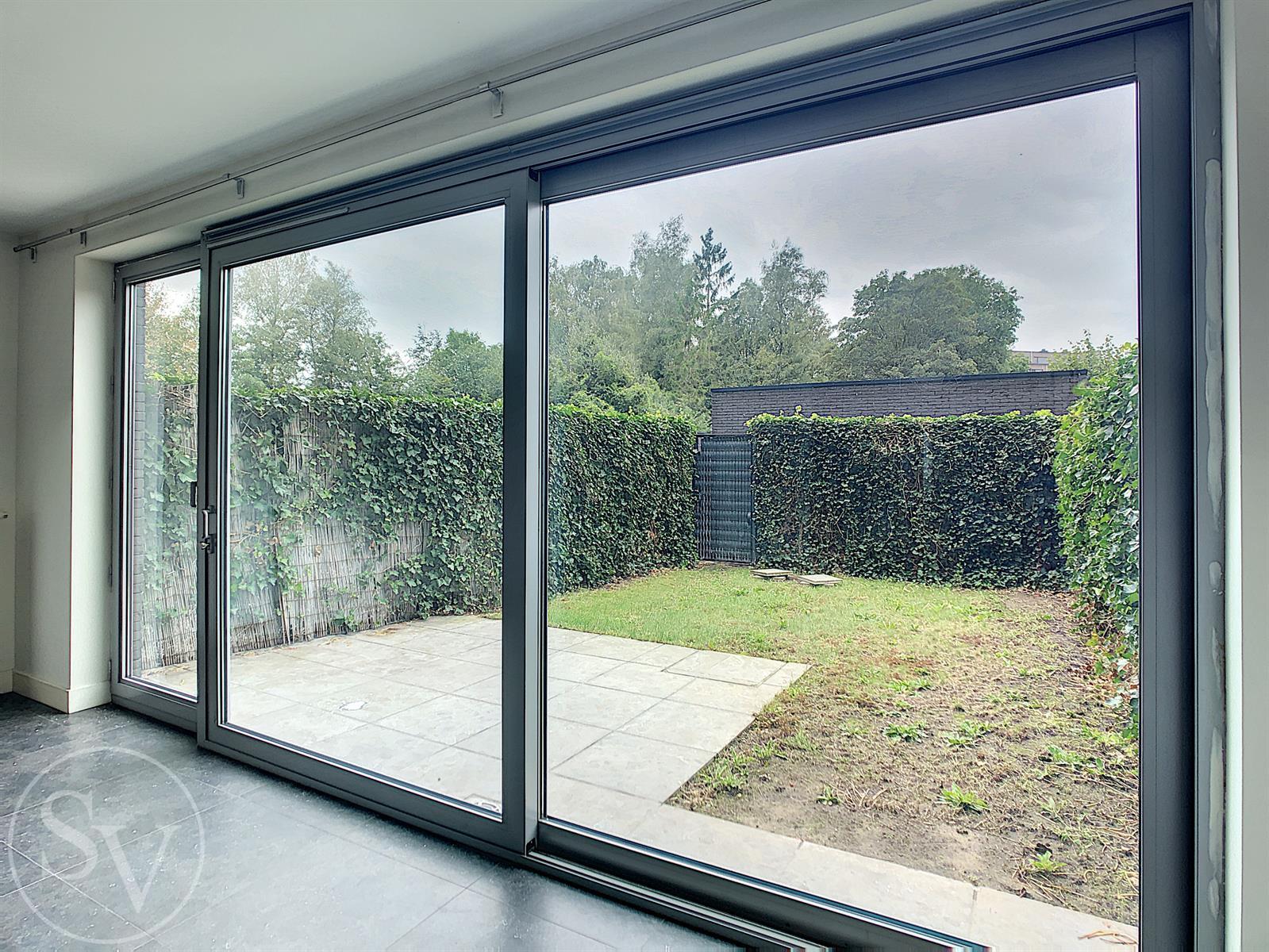 Gelijkvloers appartement, 2 slpk en tuin! foto 2