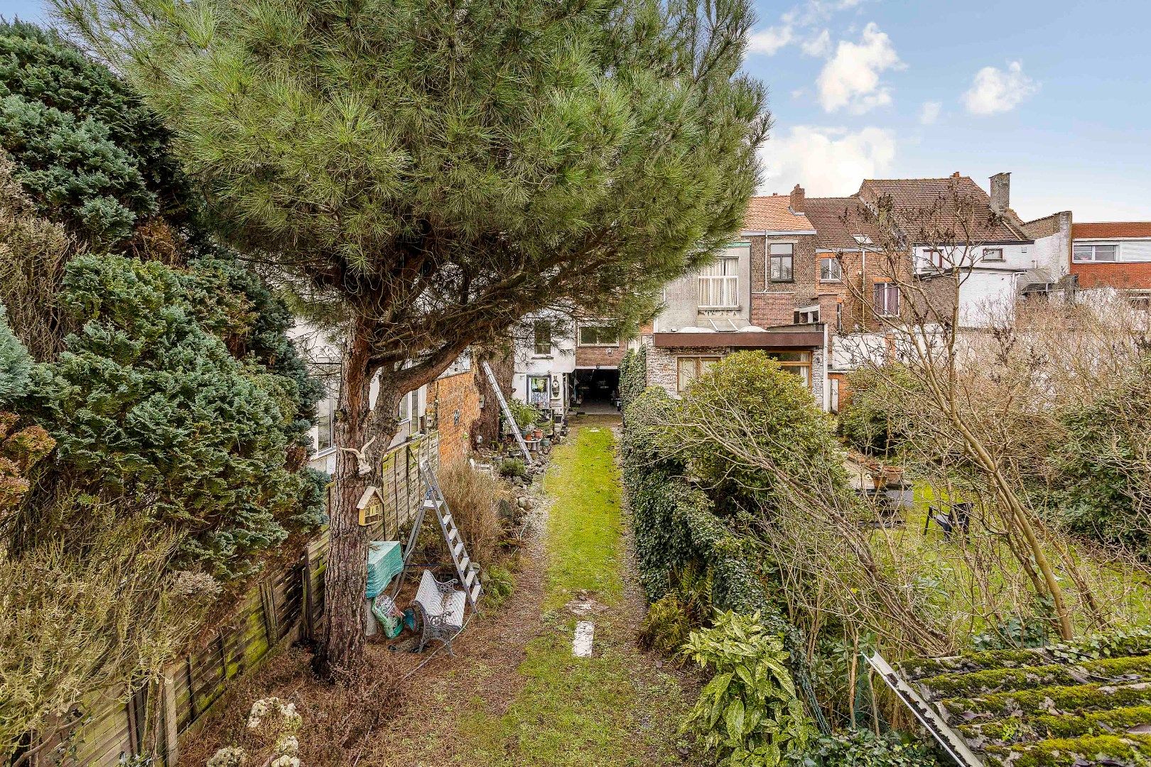 Te renoveren opbrengsteigendom met twee appartementen, parkings en tuin foto 25