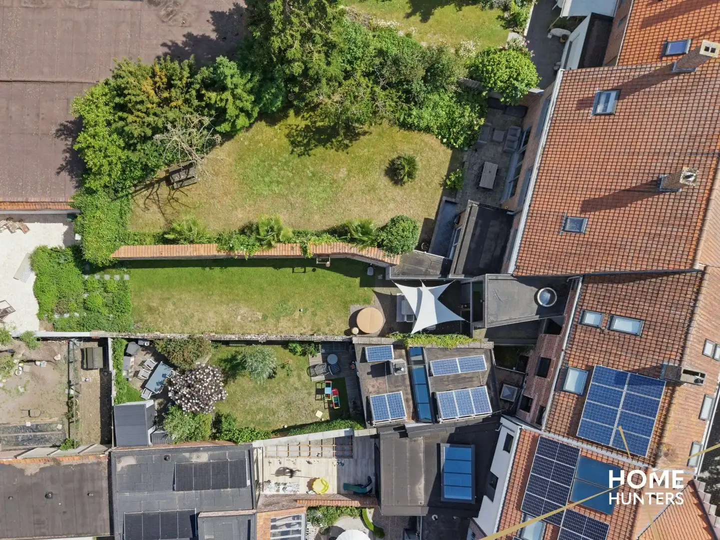 Statige stadswoning met uitzonderlijke volumes, garage en prachtige tuin in hartje Ieper foto 38
