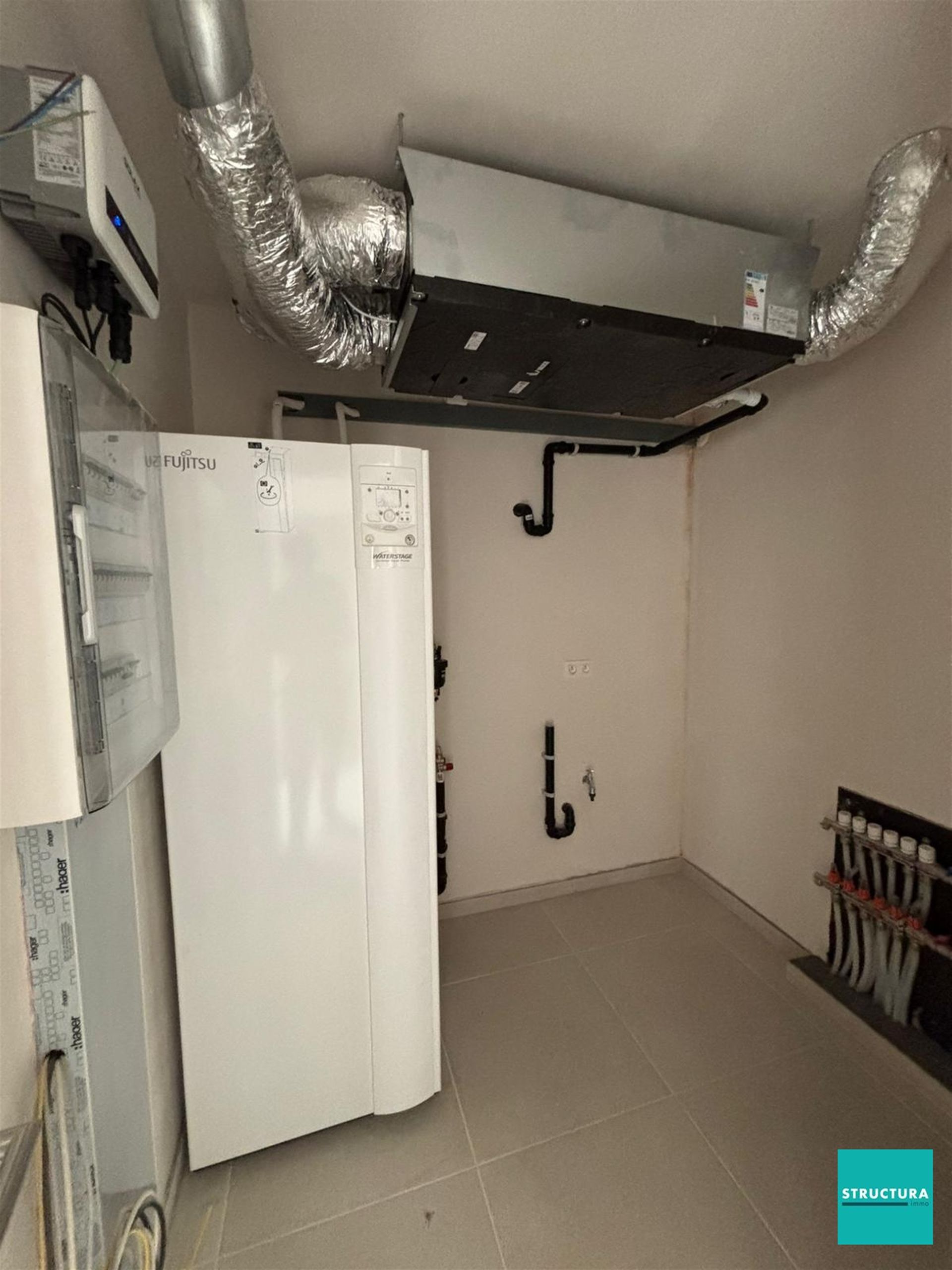 Appartement met 2 slaapkamers en 2 staanplaatsen in centrum Merchtem foto 12