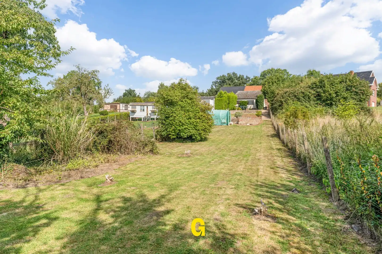 Grondig te renoveren woning met degelijke structuur en ruime tuin op 10a 67ca, met weids zicht op de achtergelegen glooiende groene omgeving foto 27