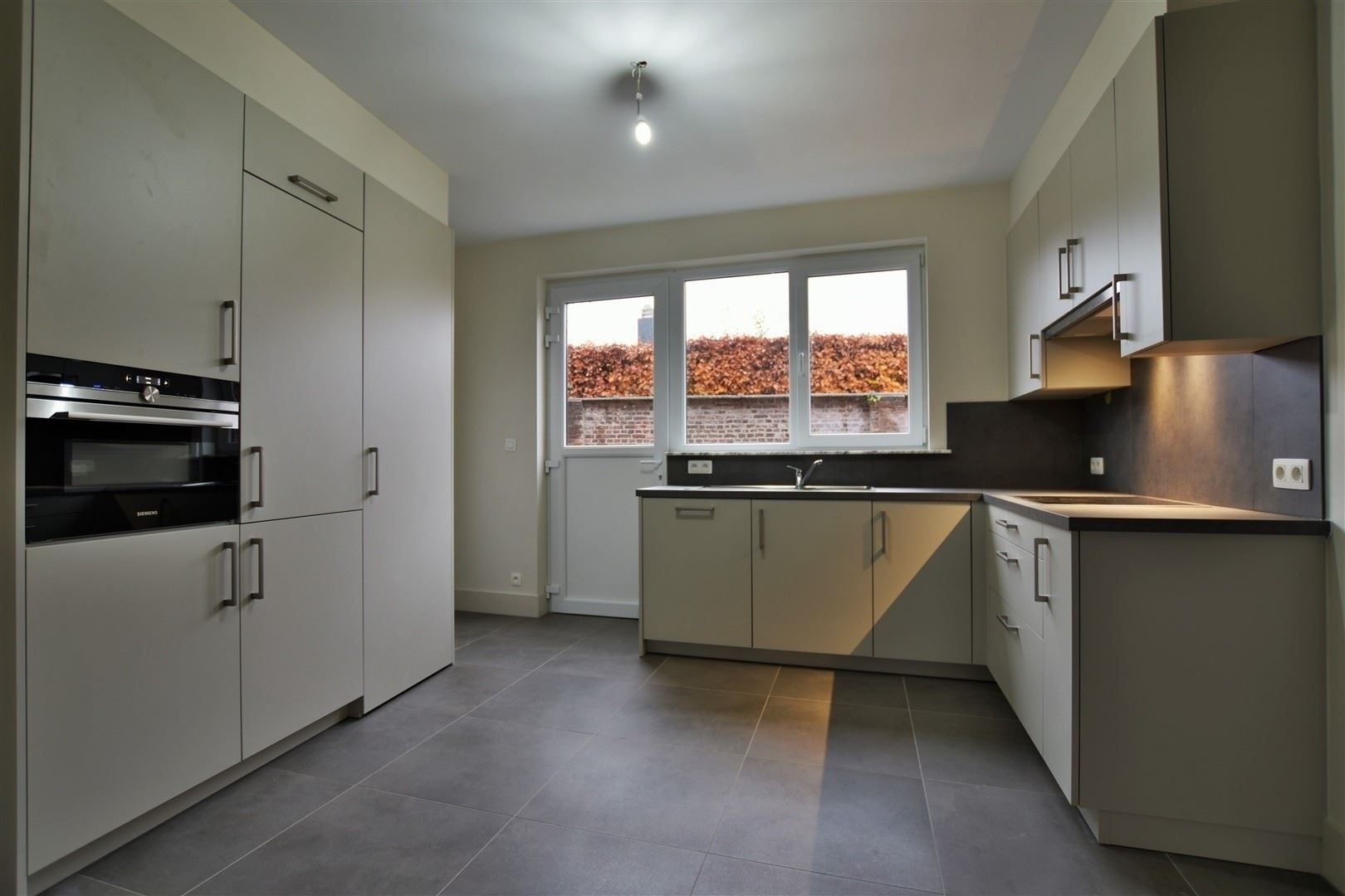 Totaal gerenoveerd GV appartement met tuin te Grembergen foto 17