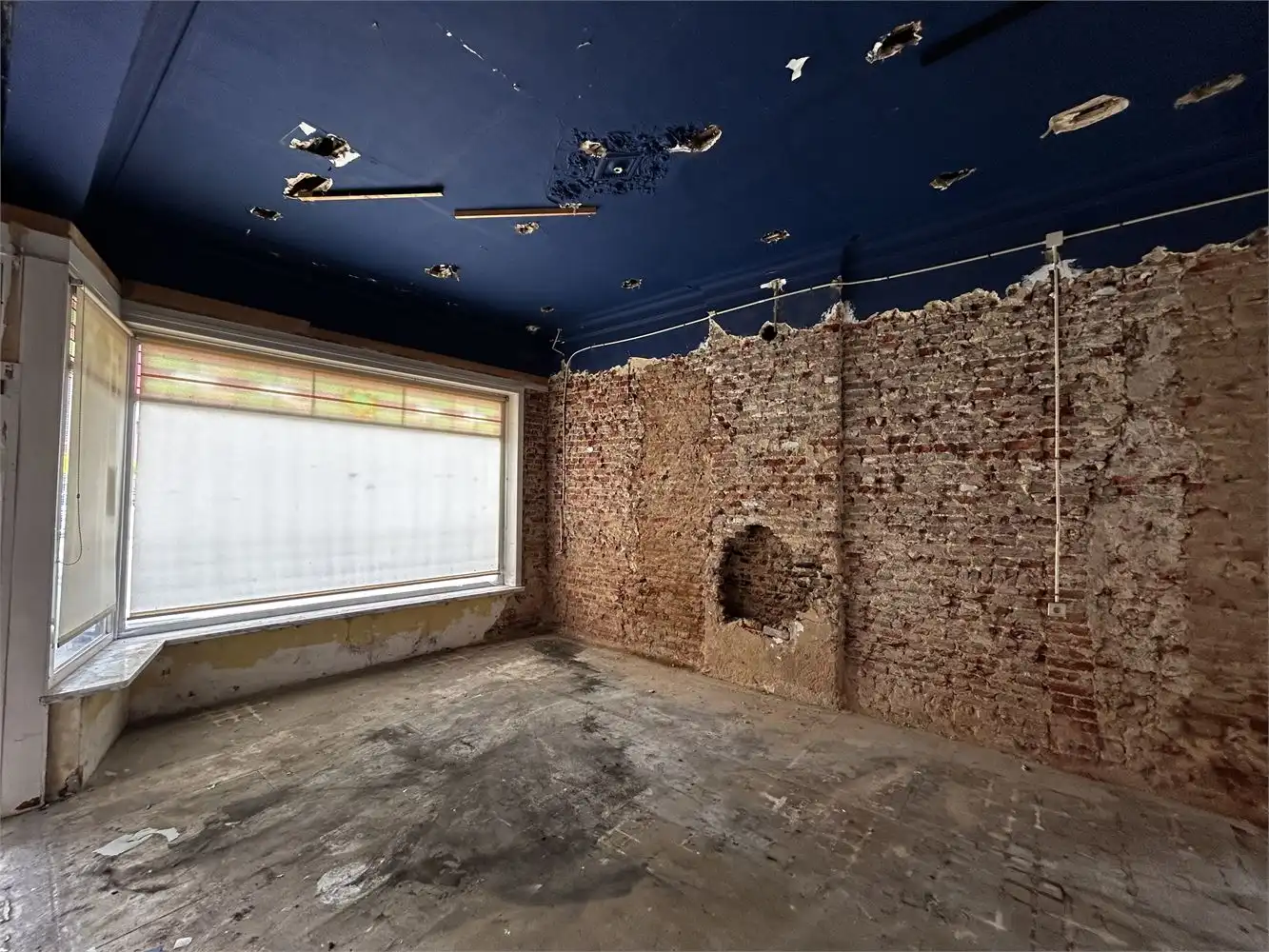 Te renoveren handelshuis met woonst foto 5