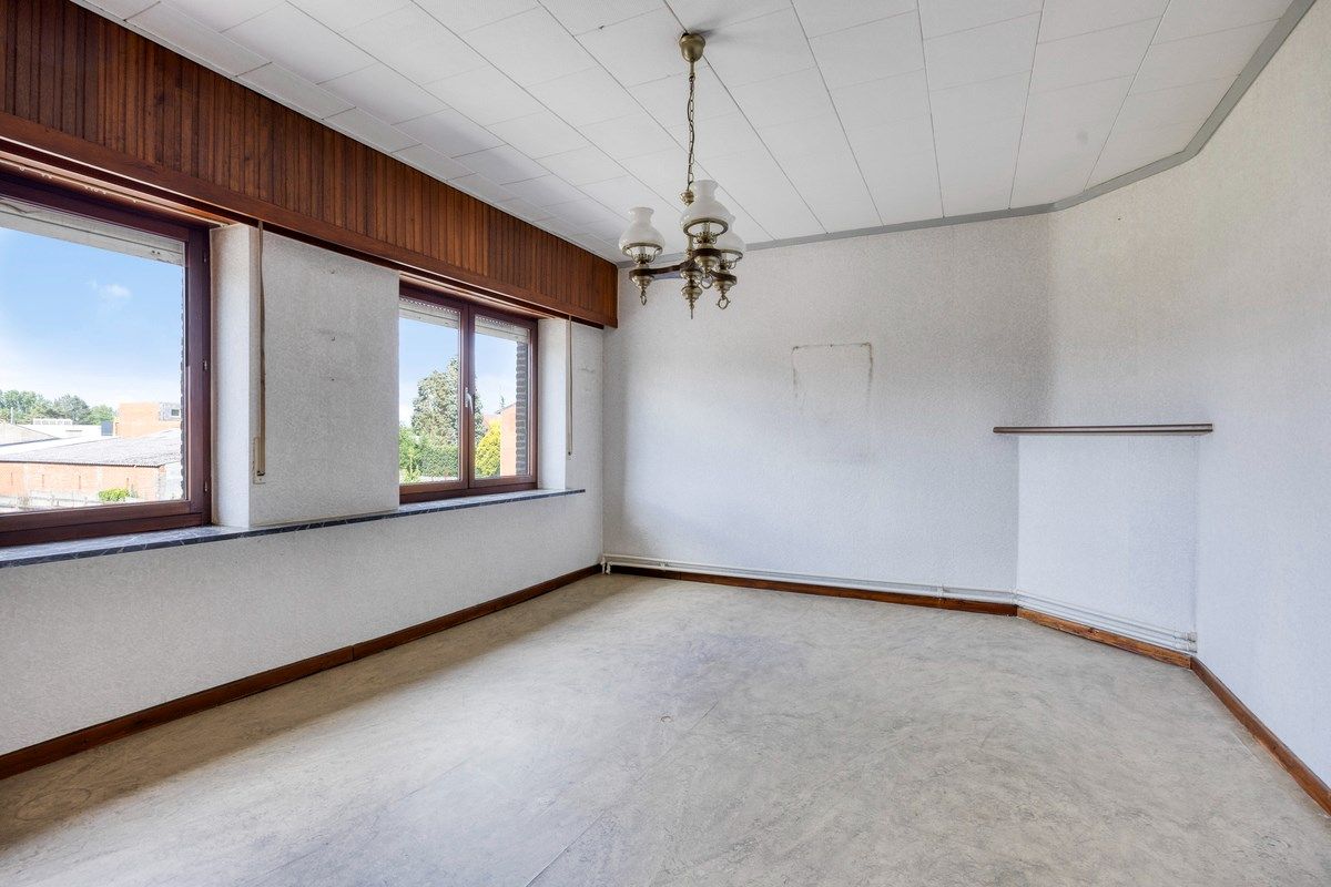 Ruim ingedeelde woning met 3slpks op een gunstige ligging. foto 15