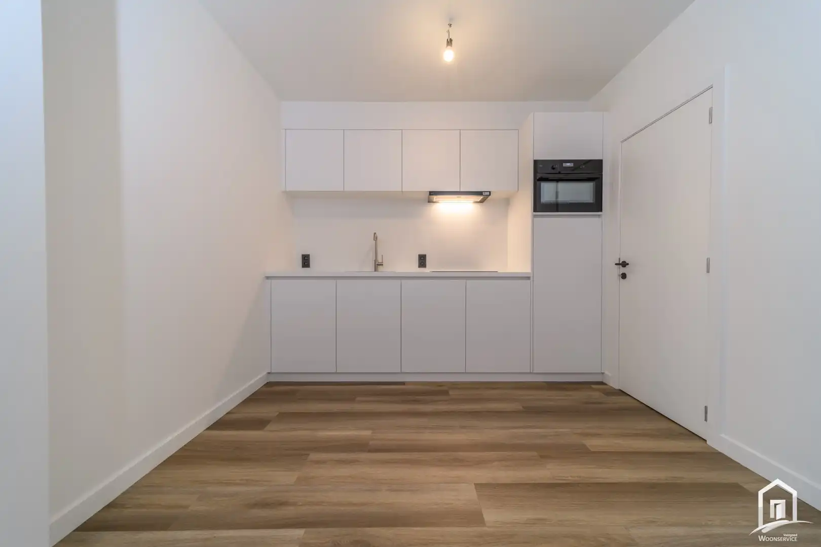 Totaal gerenoveerd gelijkvloers-appartement met tuintje foto 6