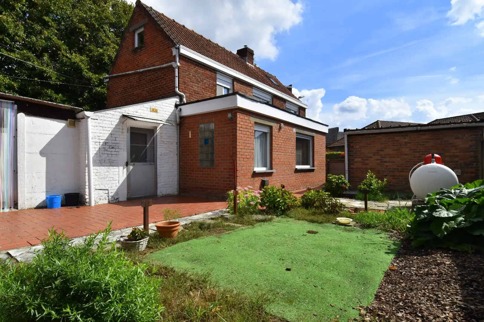 Woning met veel potentieel, garage en charmante tuin te koop in Kuurne foto 9