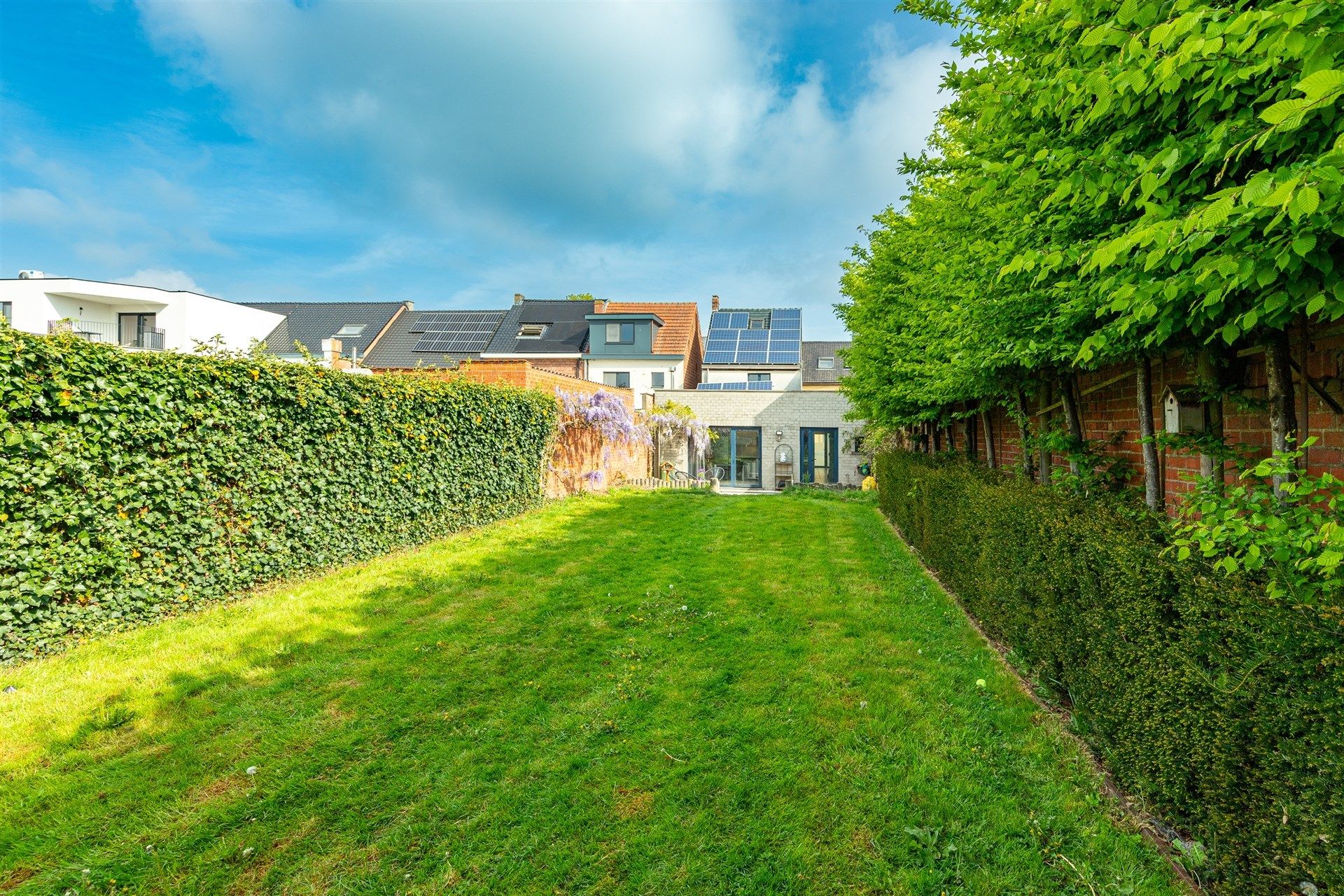 Bijzonder ruime woning met diepe tuin in Wetteren centrum foto 21