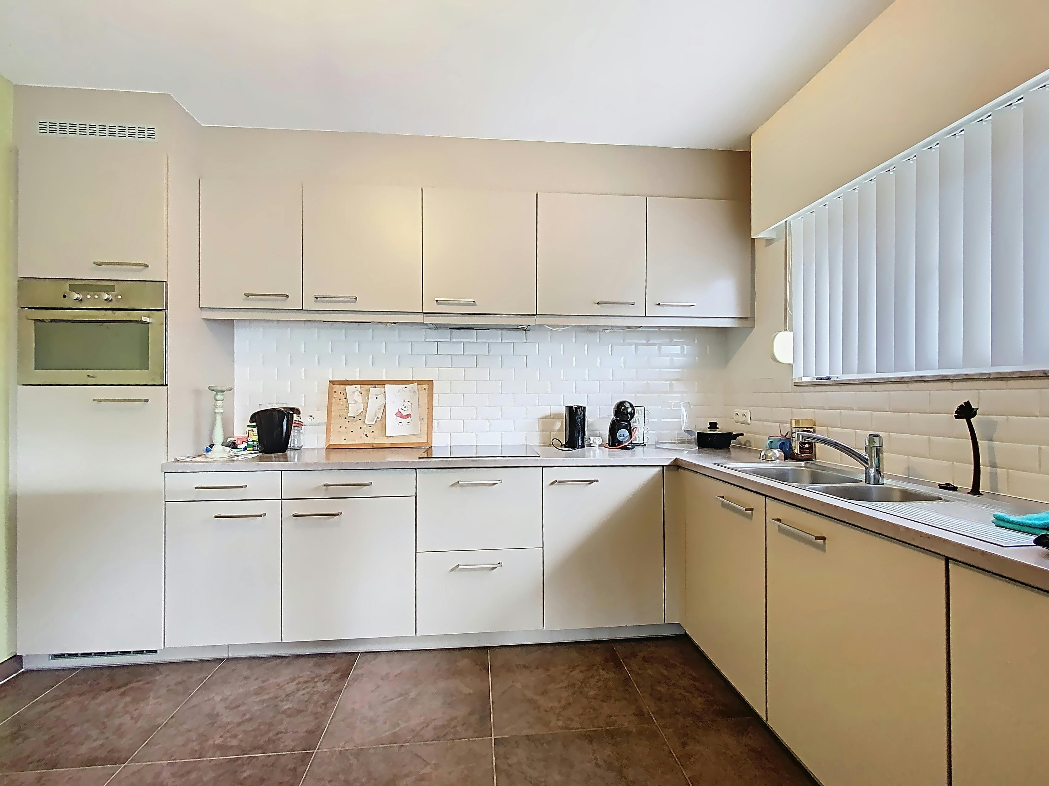 Gezellig gelijkvloers appartement met 2 slaapkamers en tuin foto 2