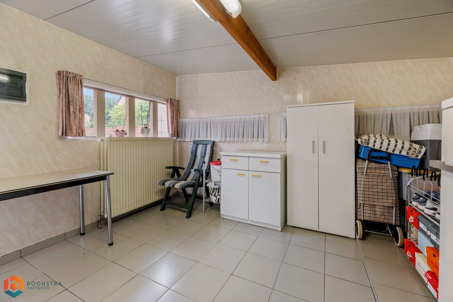 Verzorgde woning met 2 slpkrs, leuke tuin en garage foto 27