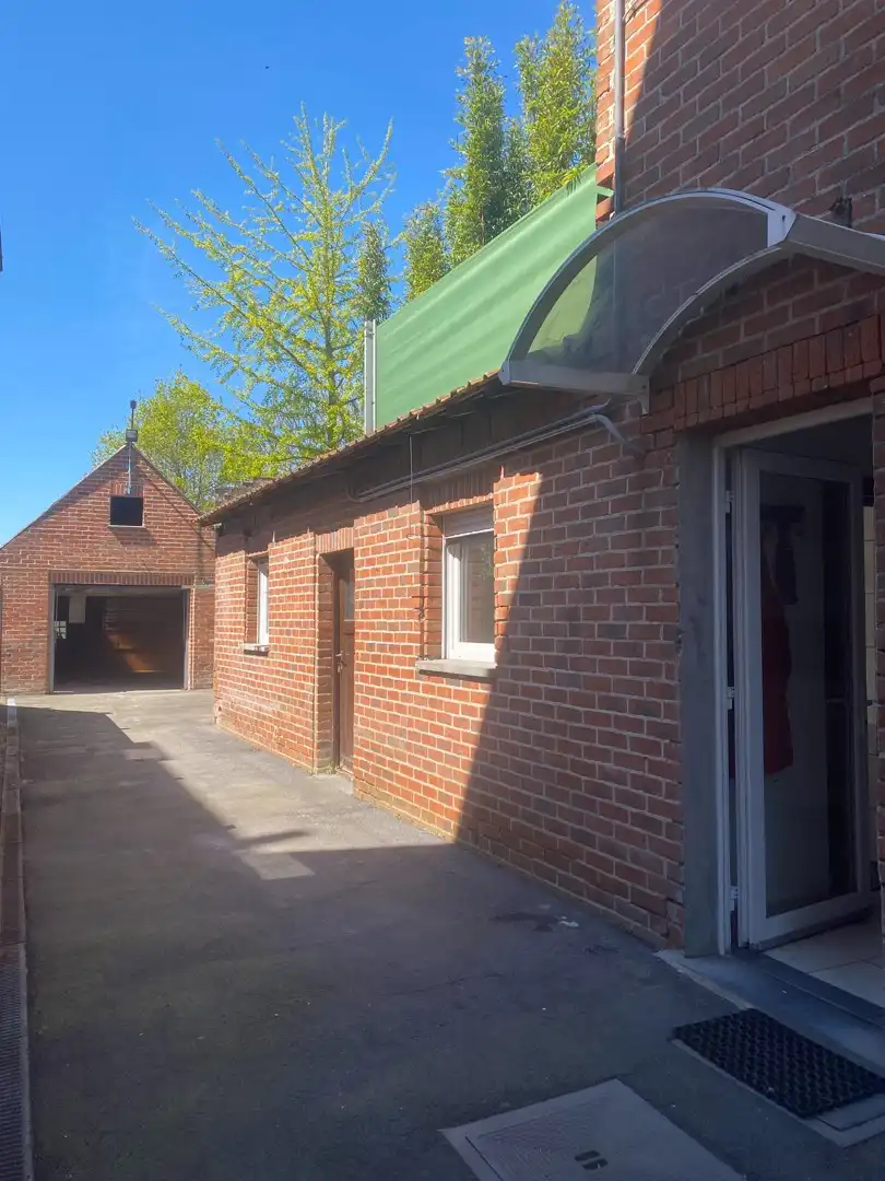 Centraal gelegen te renoveren woning met ruime garage en achterliggende tuin foto 23