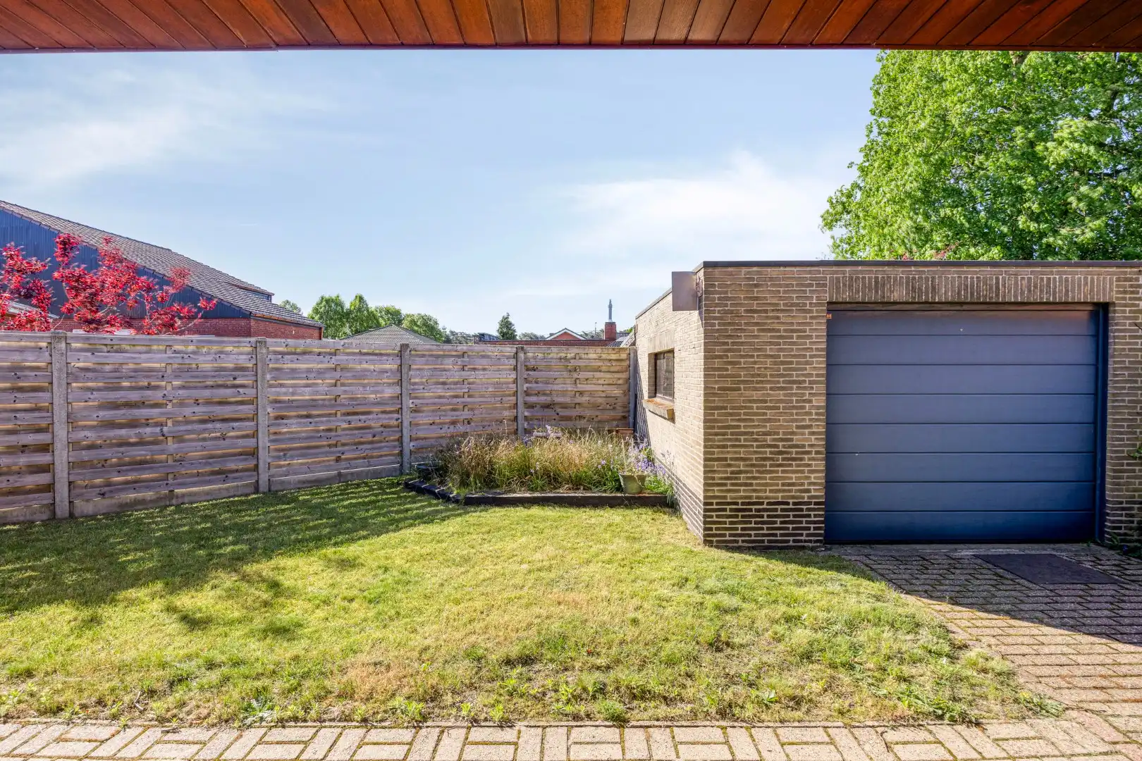 Rustig gelegen op te frissen gelijkvloers woning. foto 22