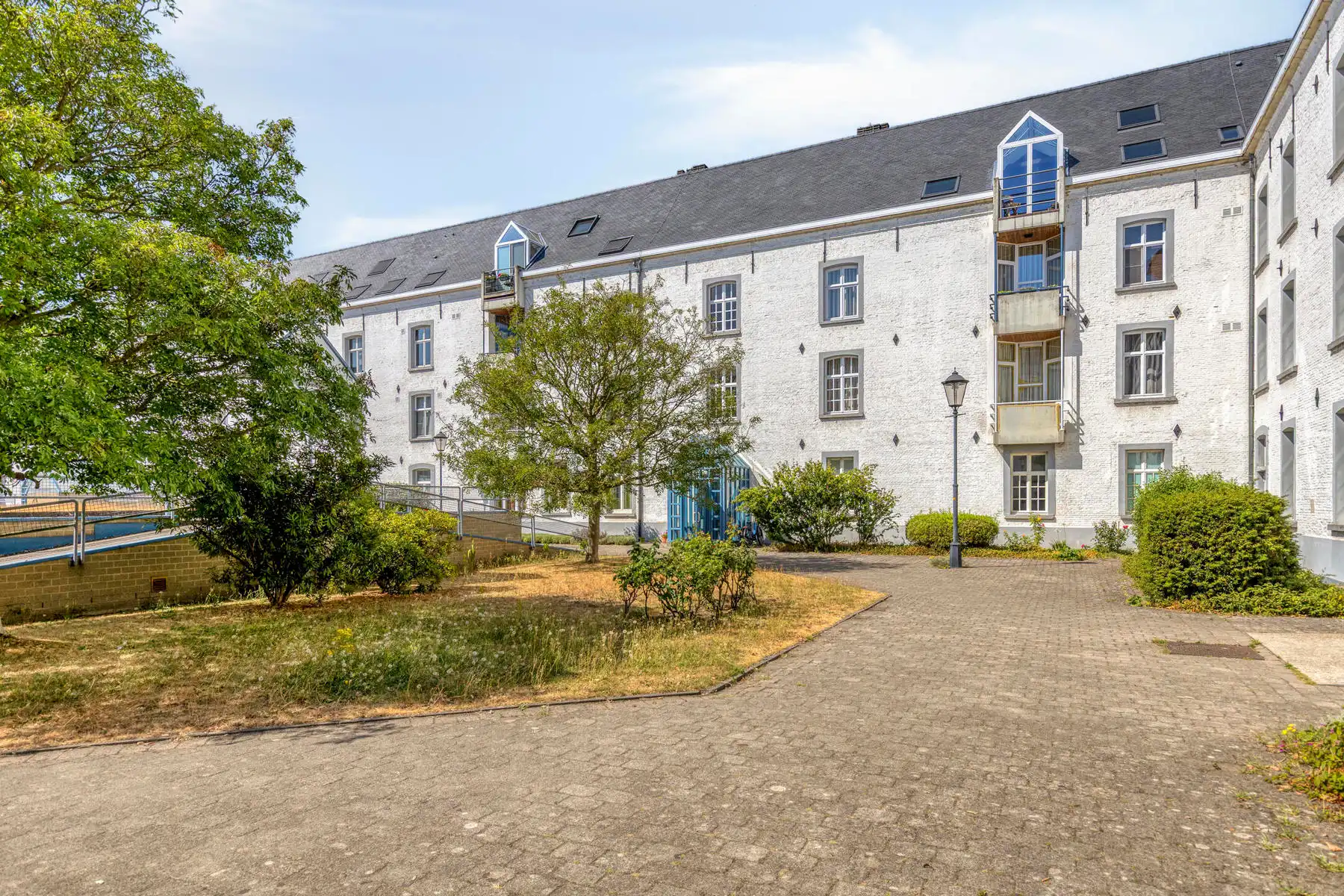 Prachtige duplex in historische Dossin Kazerne foto {{pictureIndex}}