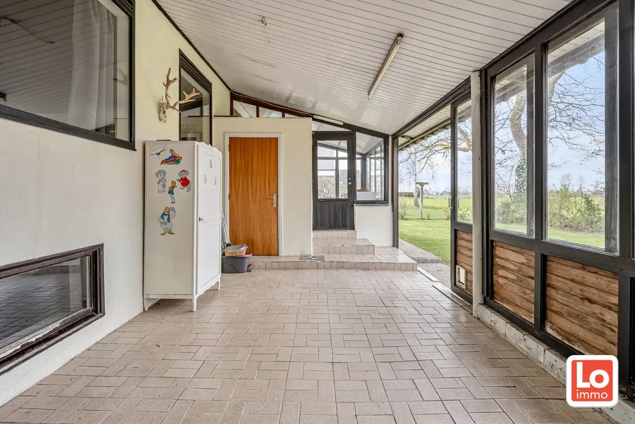Ruime volledig te renoveren open gelijkvloerse prefab woning met inpandige garage en tuin met open zicht of perceel bouwgrond met afbraak/heropbouw mogelijkheden aan 6% BTW op een rustige locatie nabij het centrum van Zeveneken! foto 16