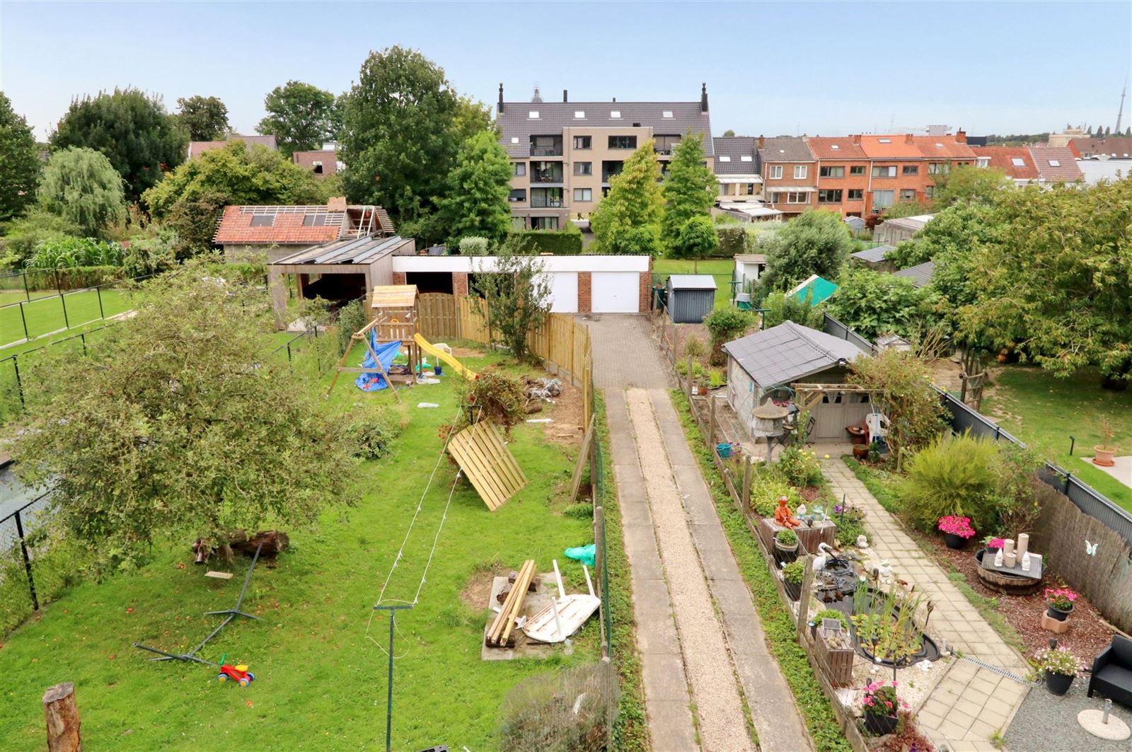 Opbrengstwoning met 2 appartementen en 5 garageboxen foto 21