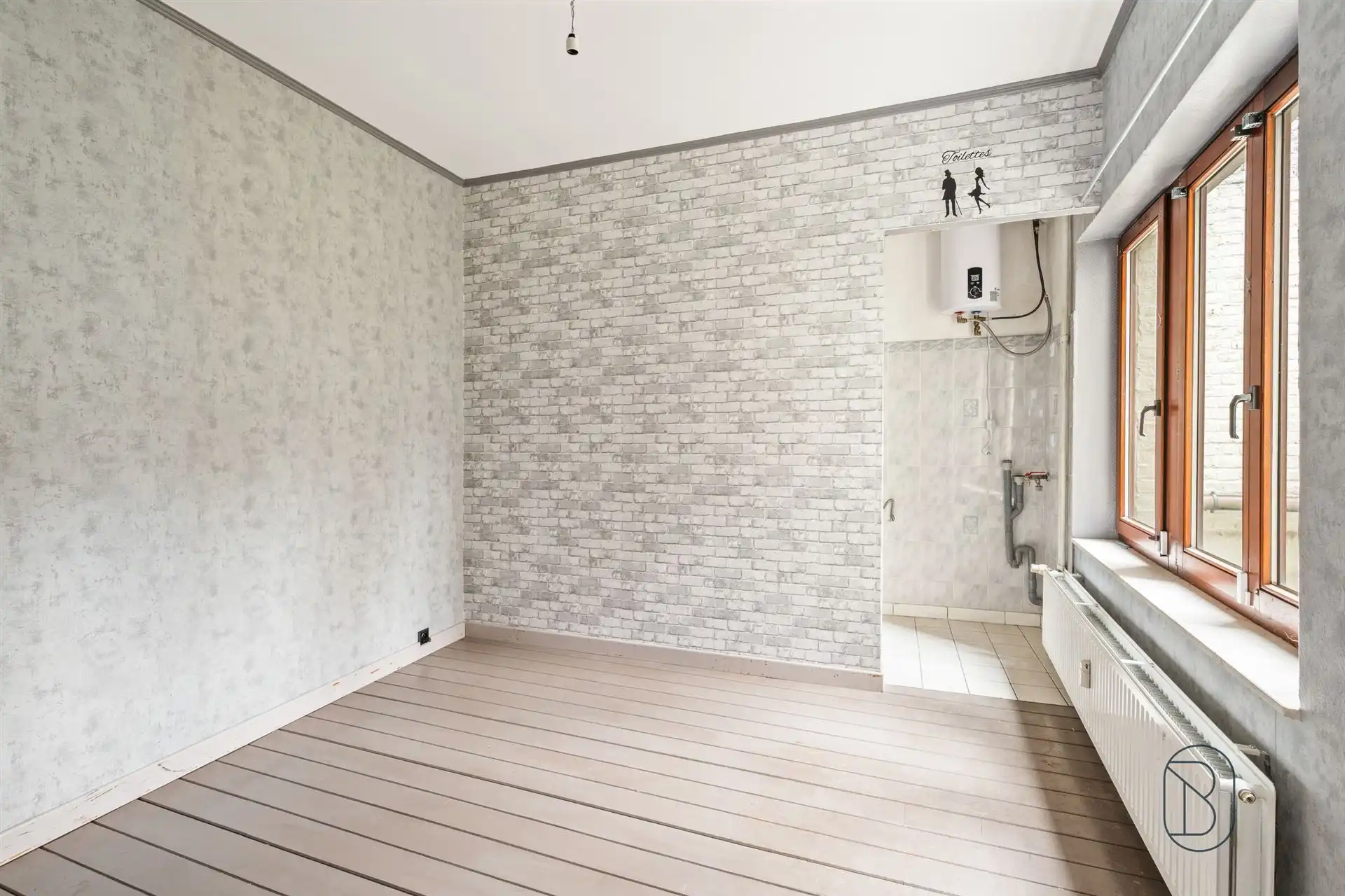 Opbrengsteigendom: handelsruimte en 2 appartementen foto 6