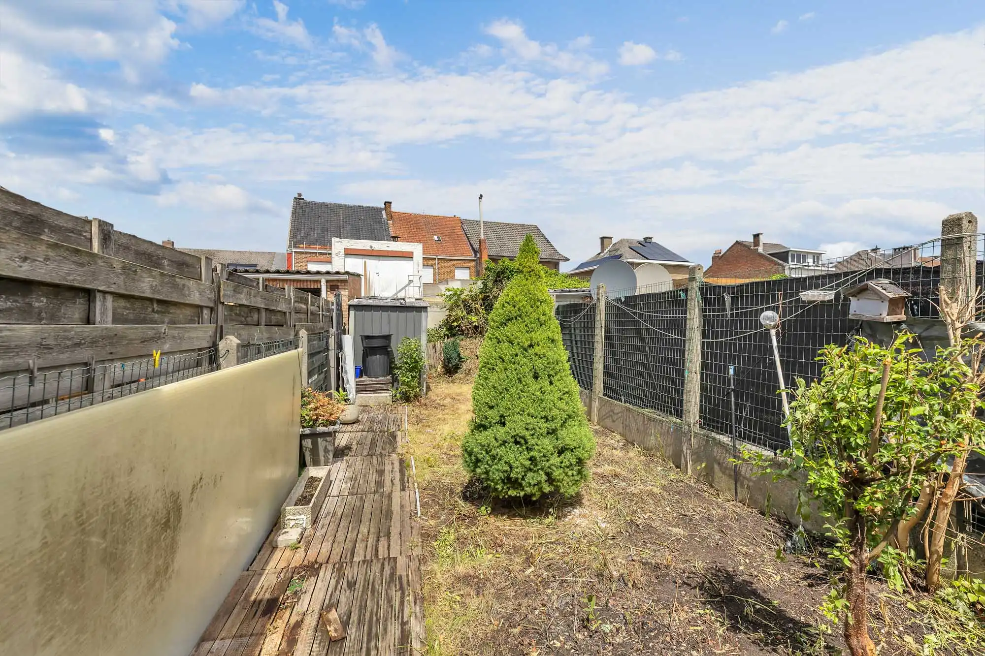 Te renoveren rijwoning met tuin foto 17