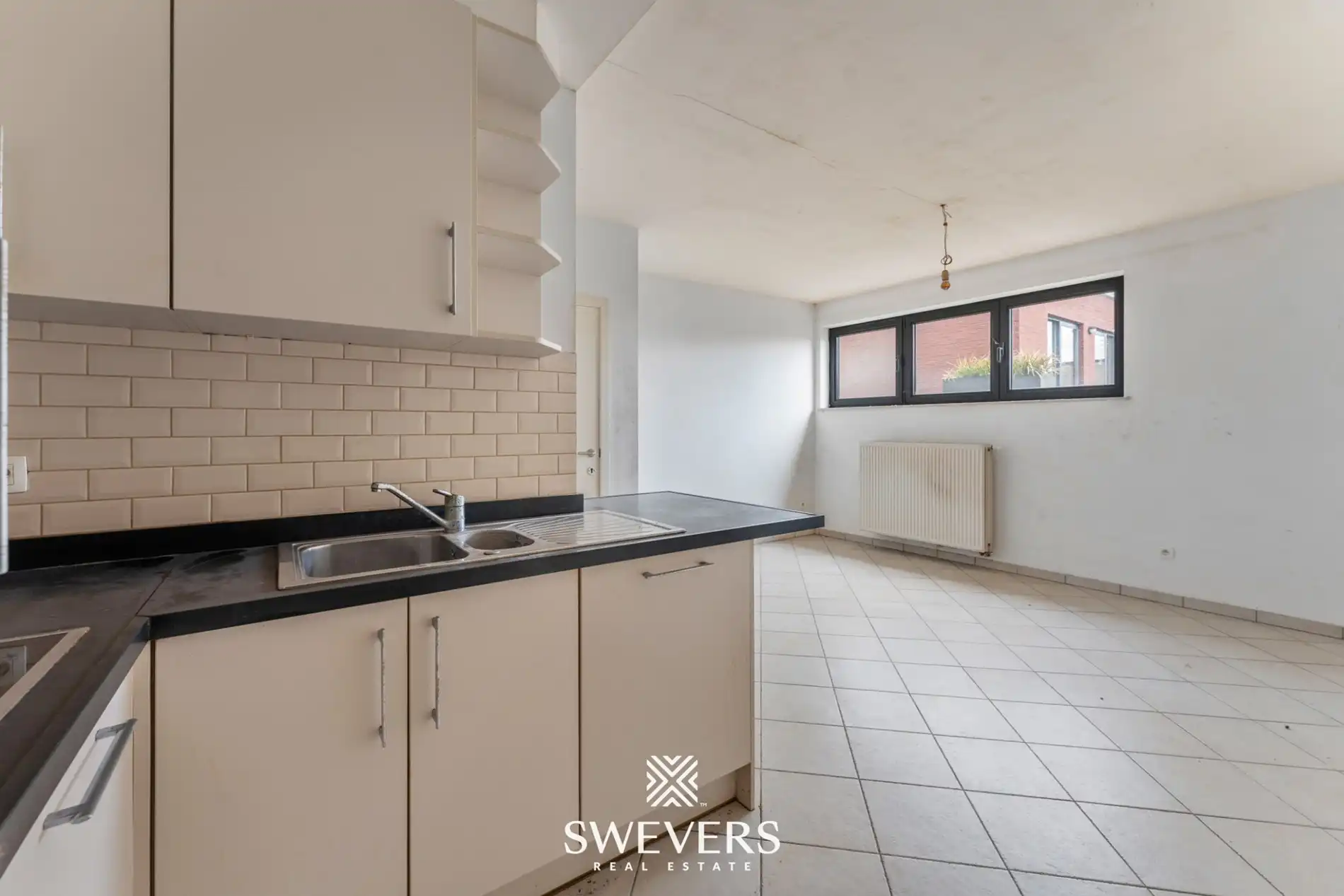 Centraal op te frissen appartement met potentieel in Halen foto 8