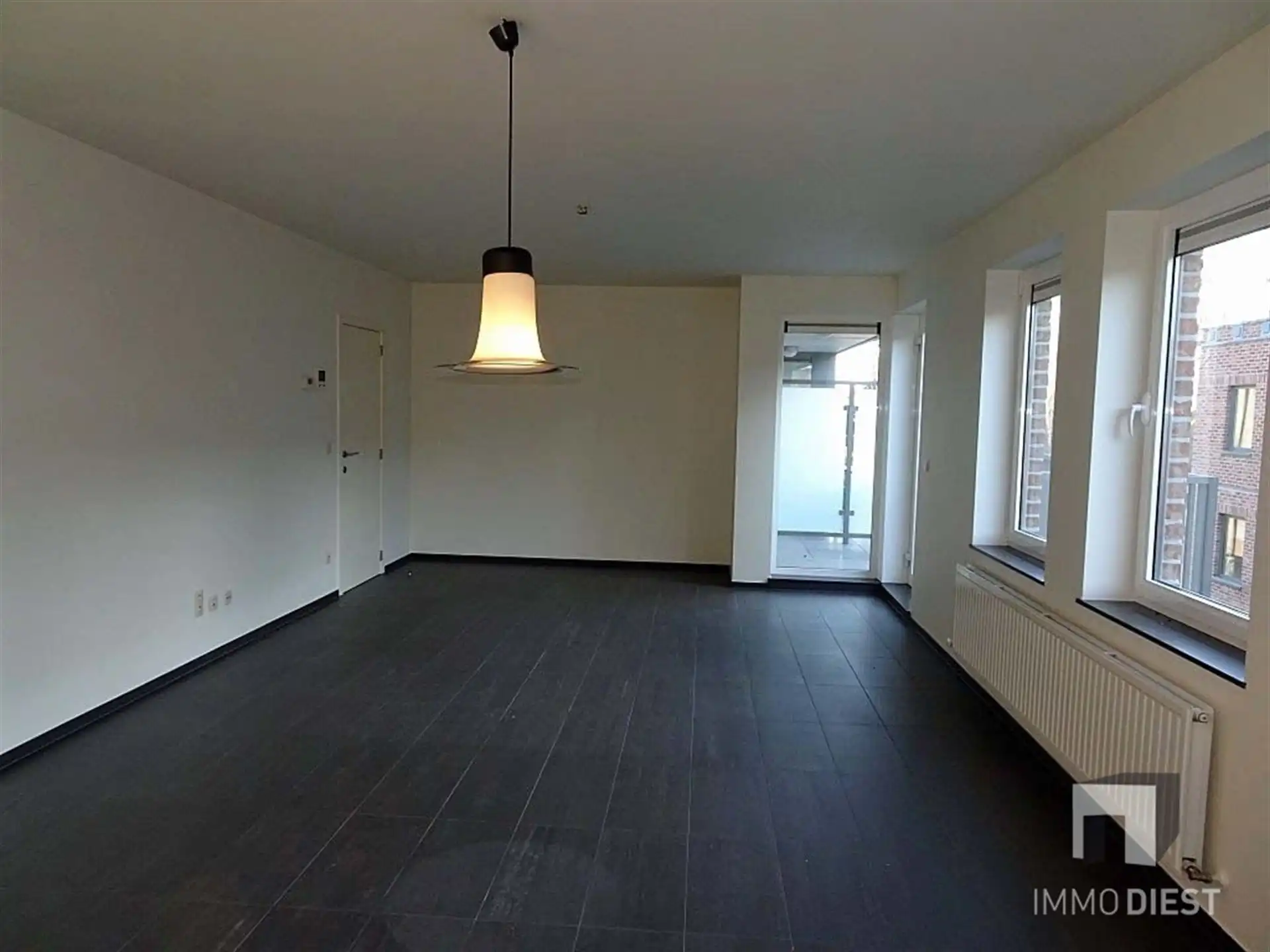 Prachtig ruim appartement met veel lichtinval bestaande uit twee slaapkamers, terras, ondergrondse staanplaats in het centrum van Halen. foto 9