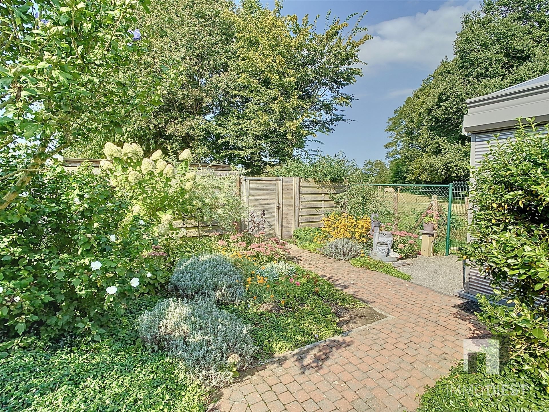 Gelijkvloerse woning met prachtige tuin en boomgaard! foto 41