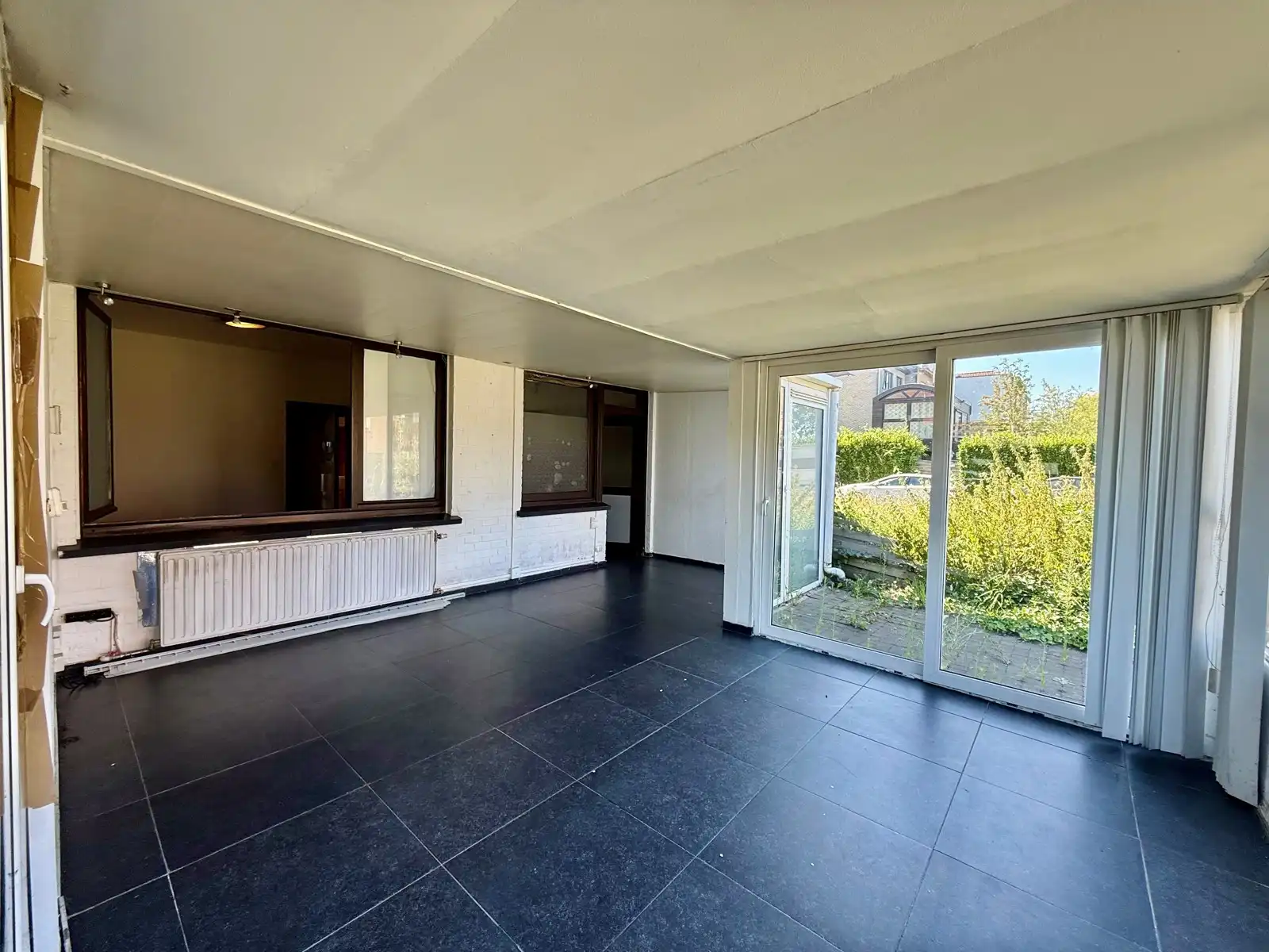 Te renoveren studio met ruime zuidwesttuin foto 8