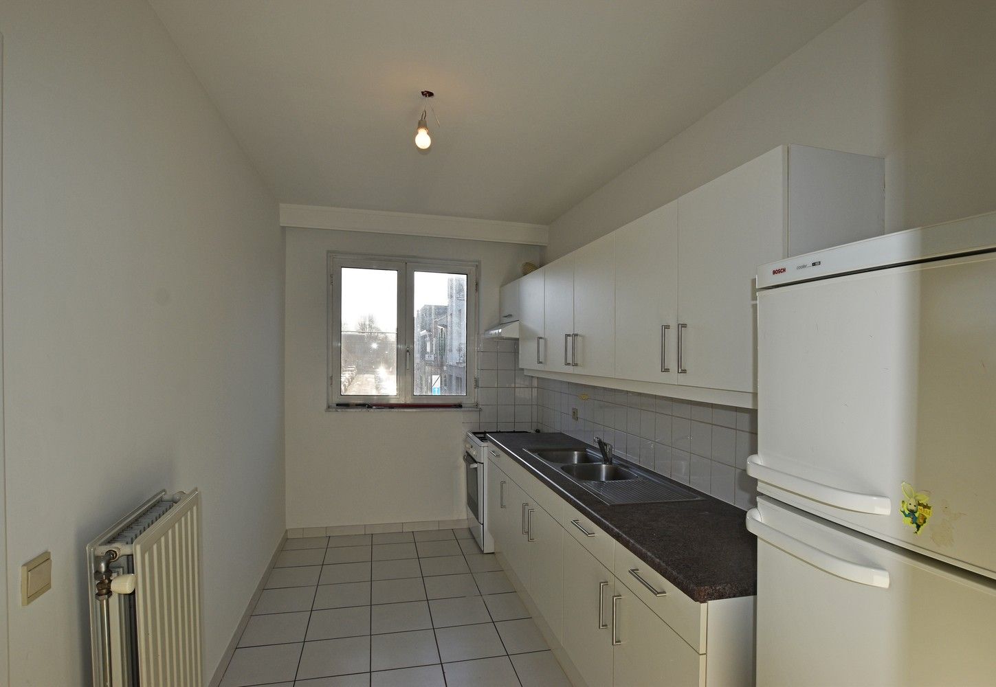 Verzorgd 2-slpk appartement met grote tuin te Borsbeek. foto 3